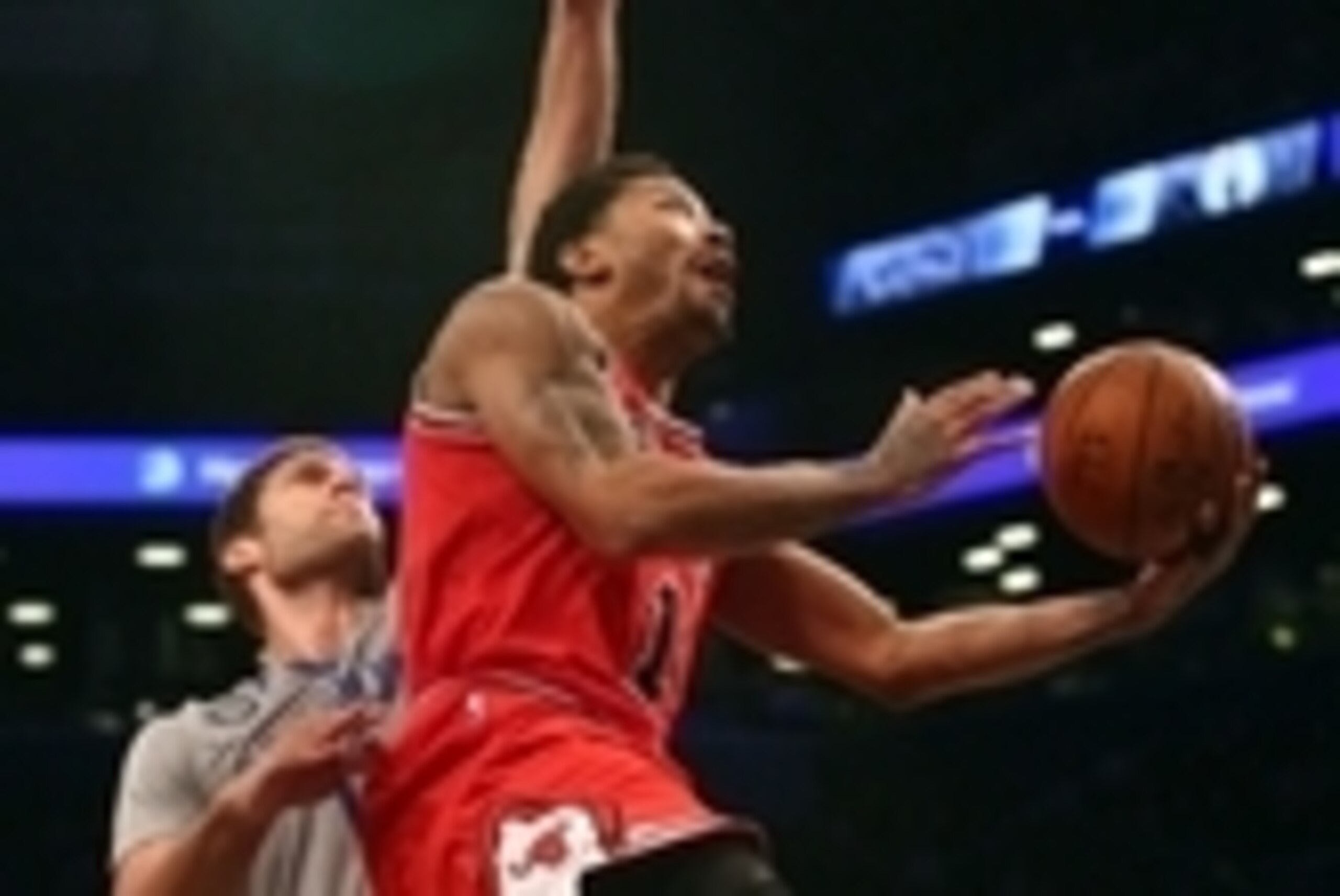 Nov 30, 2014; Brooklyn, NY, USA; Chicago Bulls point guard Derrick Rose (1) shoots the ball around Brooklyn Nets center Brook Lopez (11) during the second quarter at Barclays Center. Mandatory Credit: Brad Penner-USA TODAY Sports