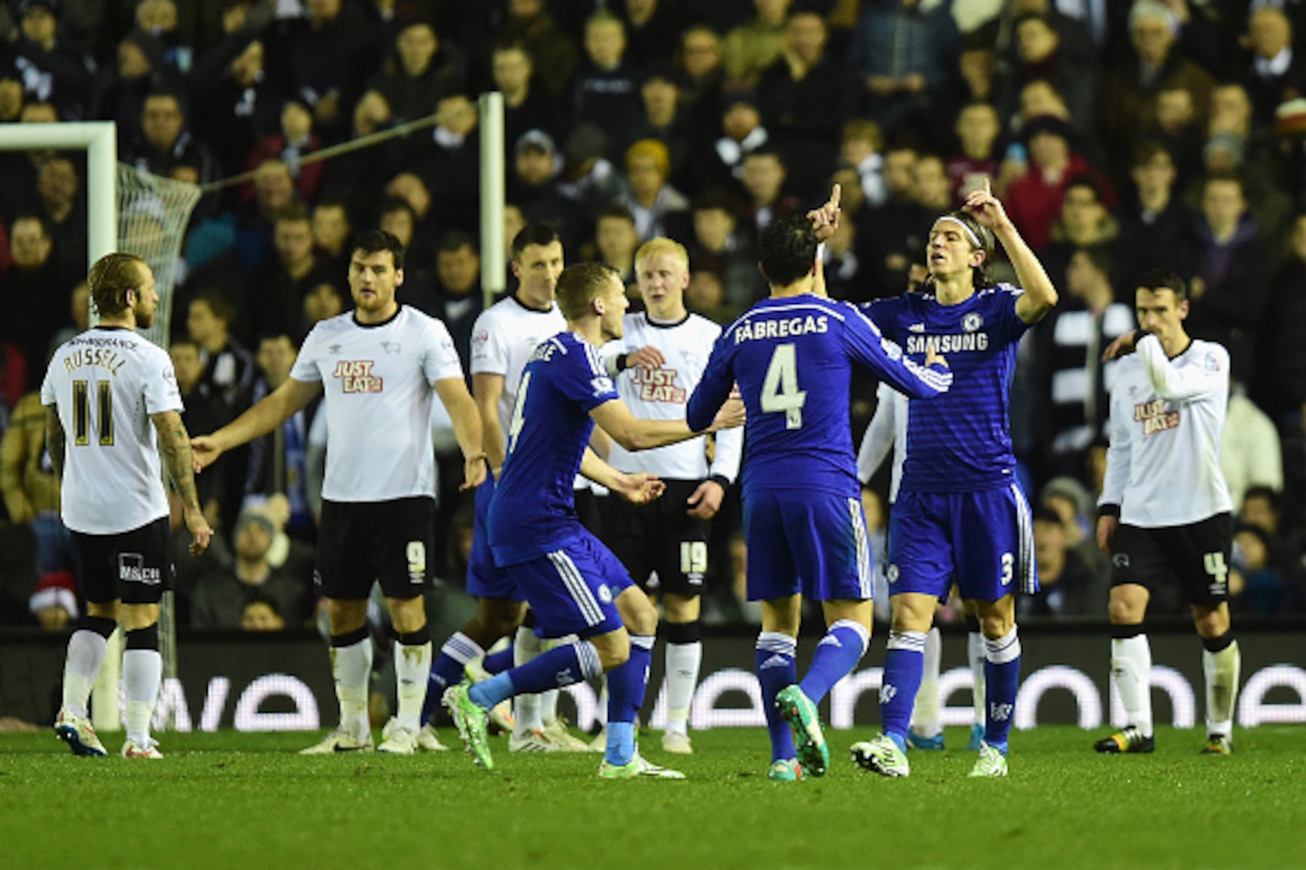DERBY, ENGLAND - DECEMBER 16:  Filipe Luis of Chelsea celebrates scoring his team's second goal during the Capital One Cup Quarter-Final match between Derby County and Chelsea at Pride Park Stadium on December 16, 2014 in Derby, England.  (Photo by Jamie 