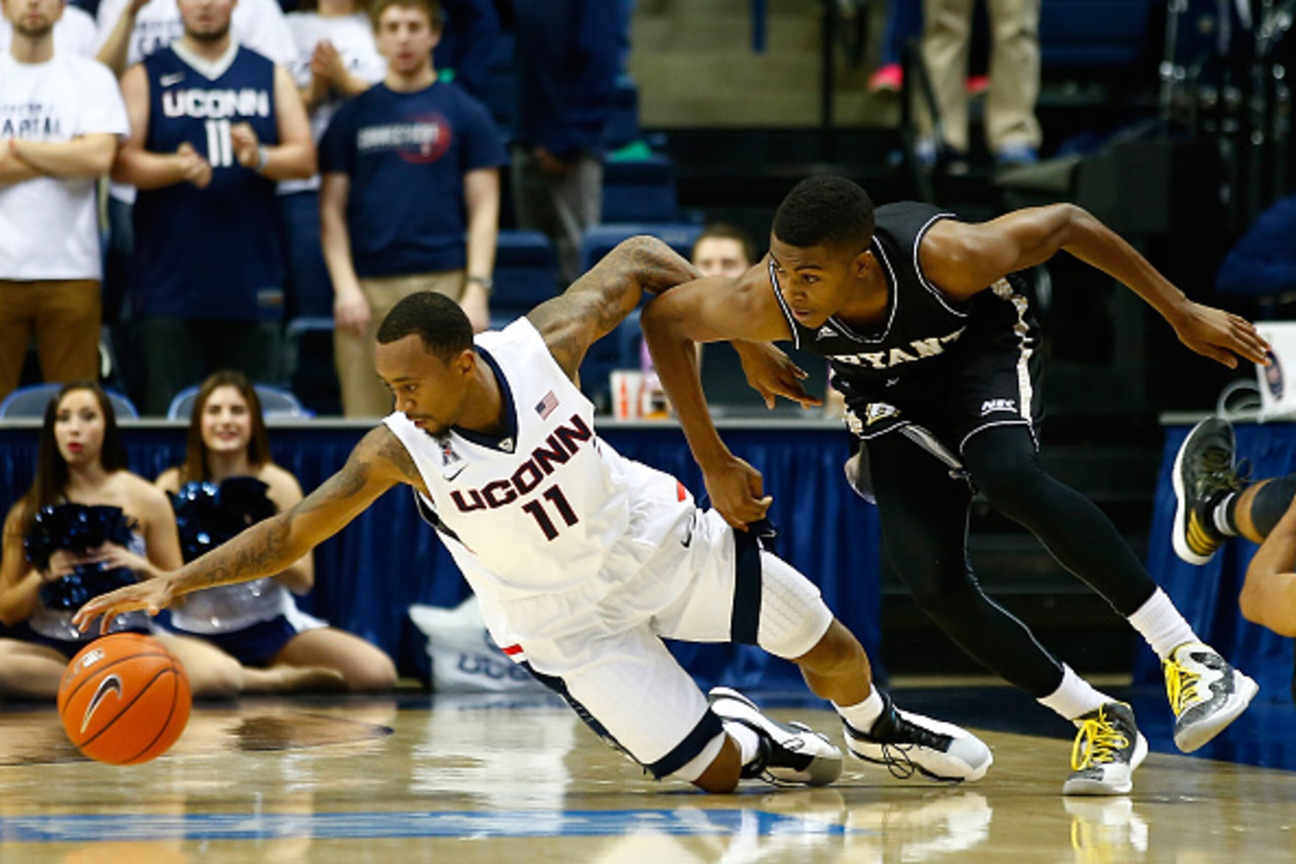 STORRS, CT - NOVEMBER 14:  Ryan Boatright #11 of the Connecticut Huskies reaches for the loose ball in front of Hunter Ware #1 of the Byrant Bulldogs in the second half during the game at Harry A. Gampel Pavilion on November 14, 2014 in Storrs, Connecticu
