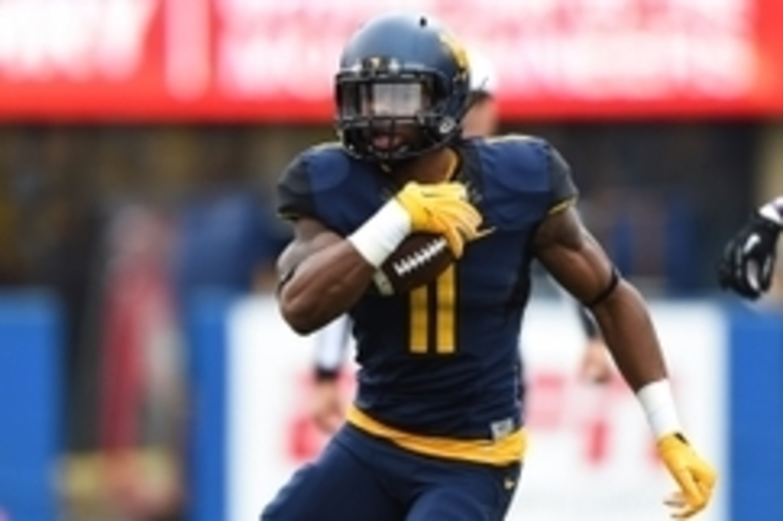 Nov 1, 2014; Morgantown, WV, USA; West Virginia Mountaineers wide receiver Kevin White (11) runs with ball after a catch during the first quarter against the TCU Horned Frogs at Milan Puskar Stadium. TCU Horned Frogs defeated West Virginia Mountaineers 31