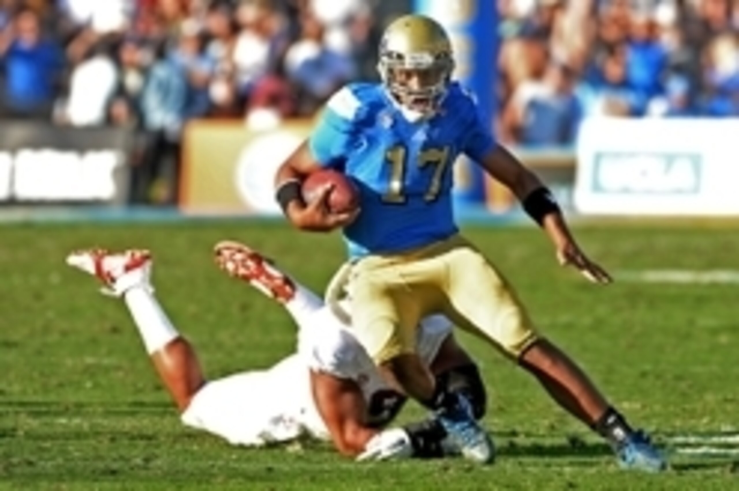 Nov 28, 2014; Pasadena, CA, USA; UCLA Bruins quarterback Brett Hundley (17) is pursued by Stanford Cardinal linebacker James Vaughters (9) in the second half of the game at the Rose Bowl. Stanford won 31-10. Mandatory Credit: Jayne Kamin-Oncea-USA TODAY S
