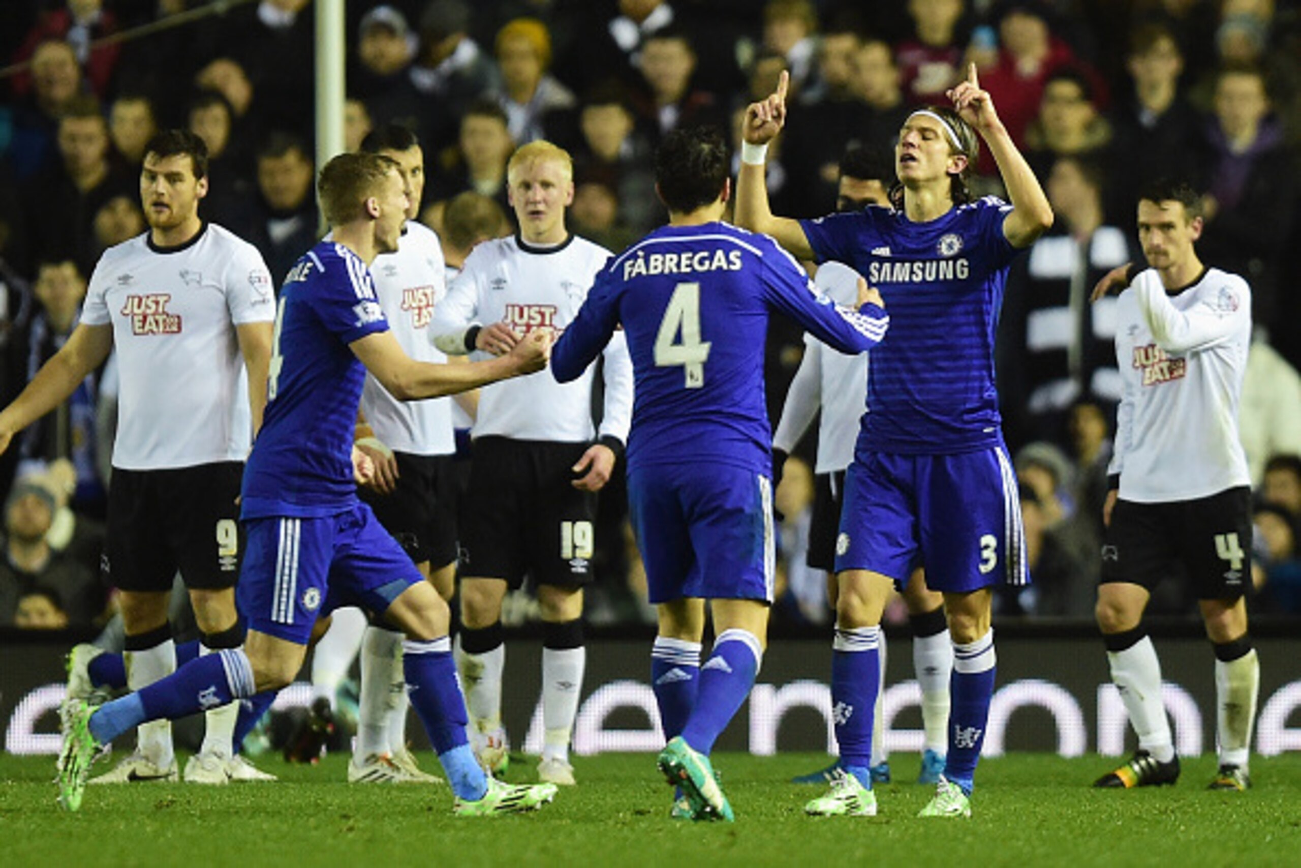 DERBY, ENGLAND - DECEMBER 16:  Filipe Luis of Chelsea celebrates scoring his team's second goal during the Capital One Cup Quarter-Final match between Derby County and Chelsea at Pride Park Stadium on December 16, 2014 in Derby, England.  (Photo by Jamie 