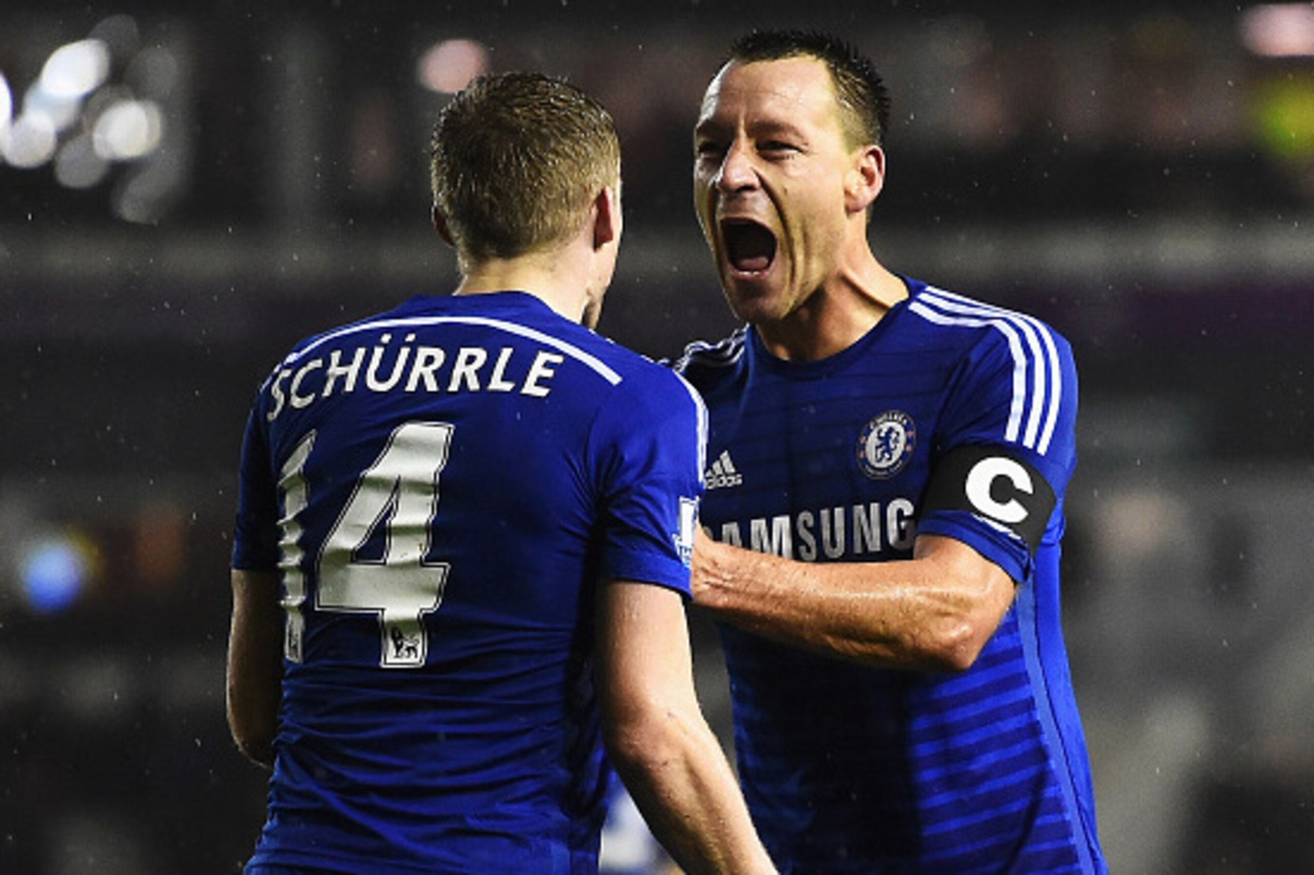 DERBY, ENGLAND - DECEMBER 16:  Andre Schurrle of Chelsea celebrates his goal with John Terry of Chelsea during the Capital One Cup Quarter-Final match between Derby County and Chelsea at Pride Park Stadium on December 16, 2014 in Derby, England.  (Photo b