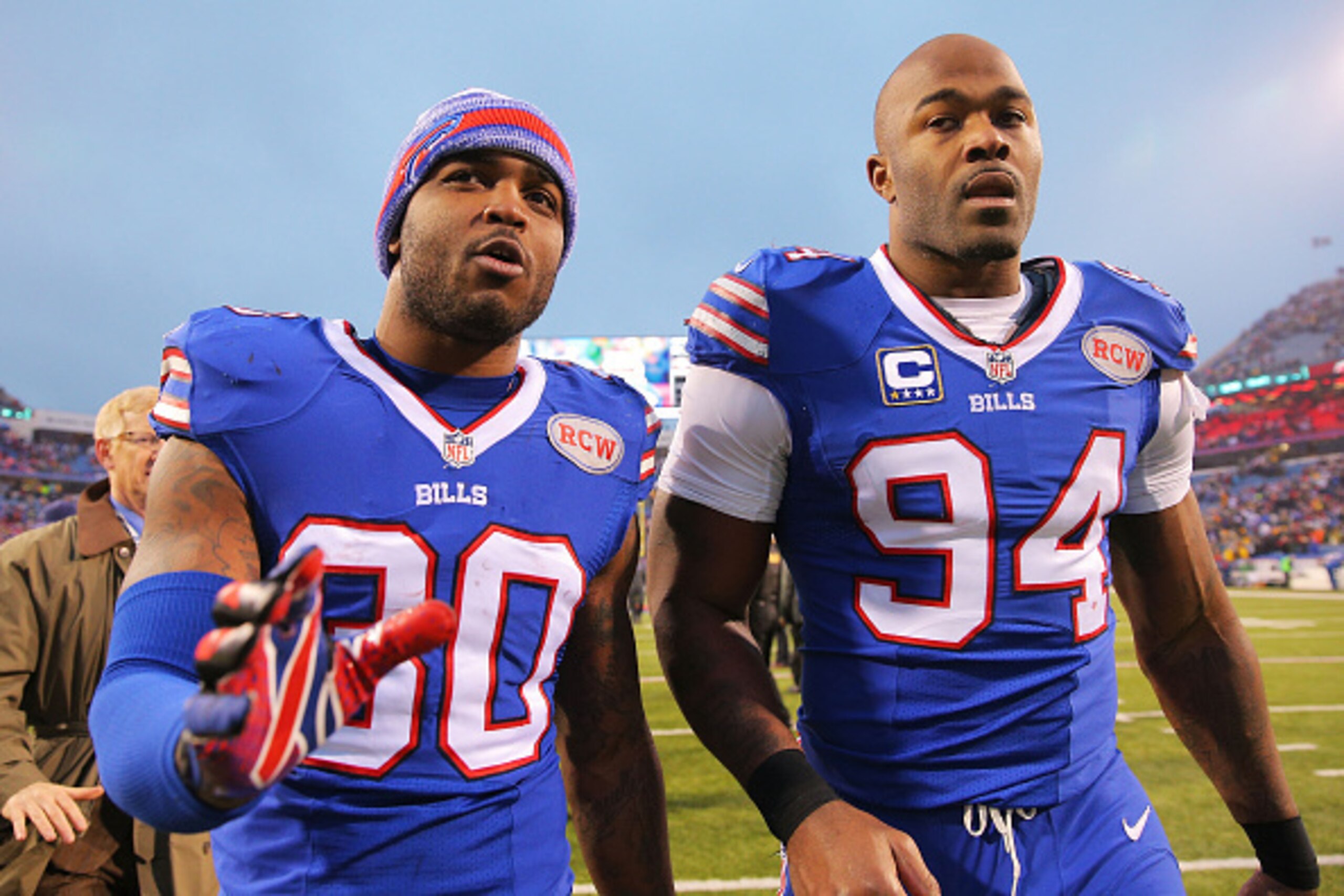 ORCHARD PARK, NY - DECEMBER 14: Bacarri Rambo #30 of the Buffalo Bills and Mario Williams #94 of the Buffalo Bills walk of the field after beating the Green Bay Packers at Ralph Wilson Stadium on December 14, 2014 in Orchard Park, New York. (Photo by B ORCHARD PARK, NY - DECEMBER 14: Bacarri Rambo #30 of the Buffalo Bills and Mario Williams #94 of the Buffalo Bills walk of the field after beating the Green Bay Packers at Ralph Wilson Stadium on December 14, 2014 in Orchard Park, New York. (Photo by B