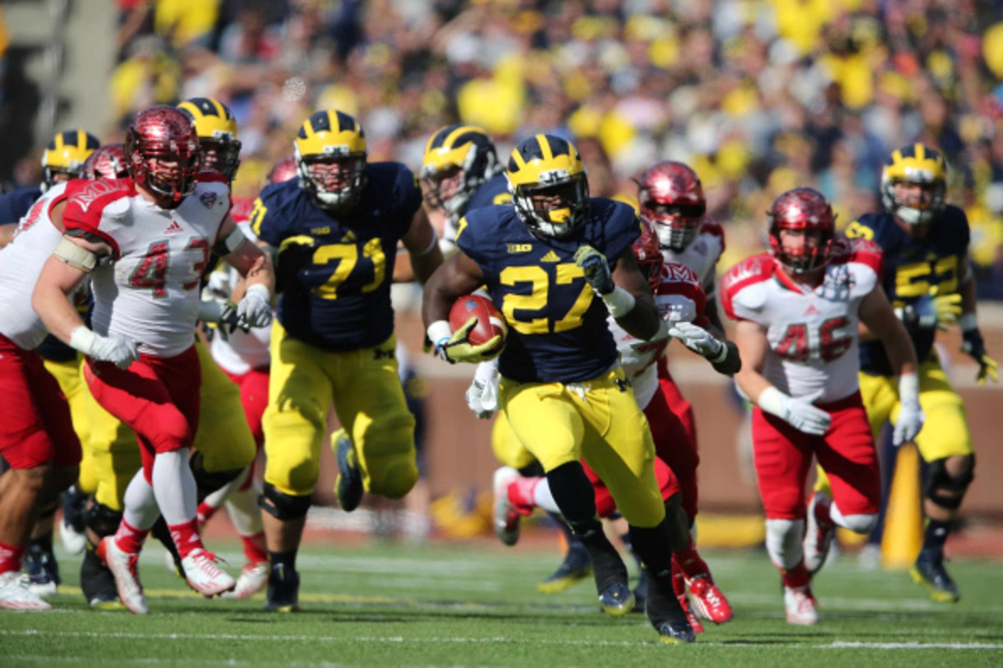 ANN ARBOR, MI - SEPTEMBER 13:  Derrick Green #27 of the University of Michigan runs for a first down during the fourth quarter of the game against the Miami University Redhawks at Michigan Stadium on September 13, 2014 in Ann Arbor, Michigan. the Wolverin