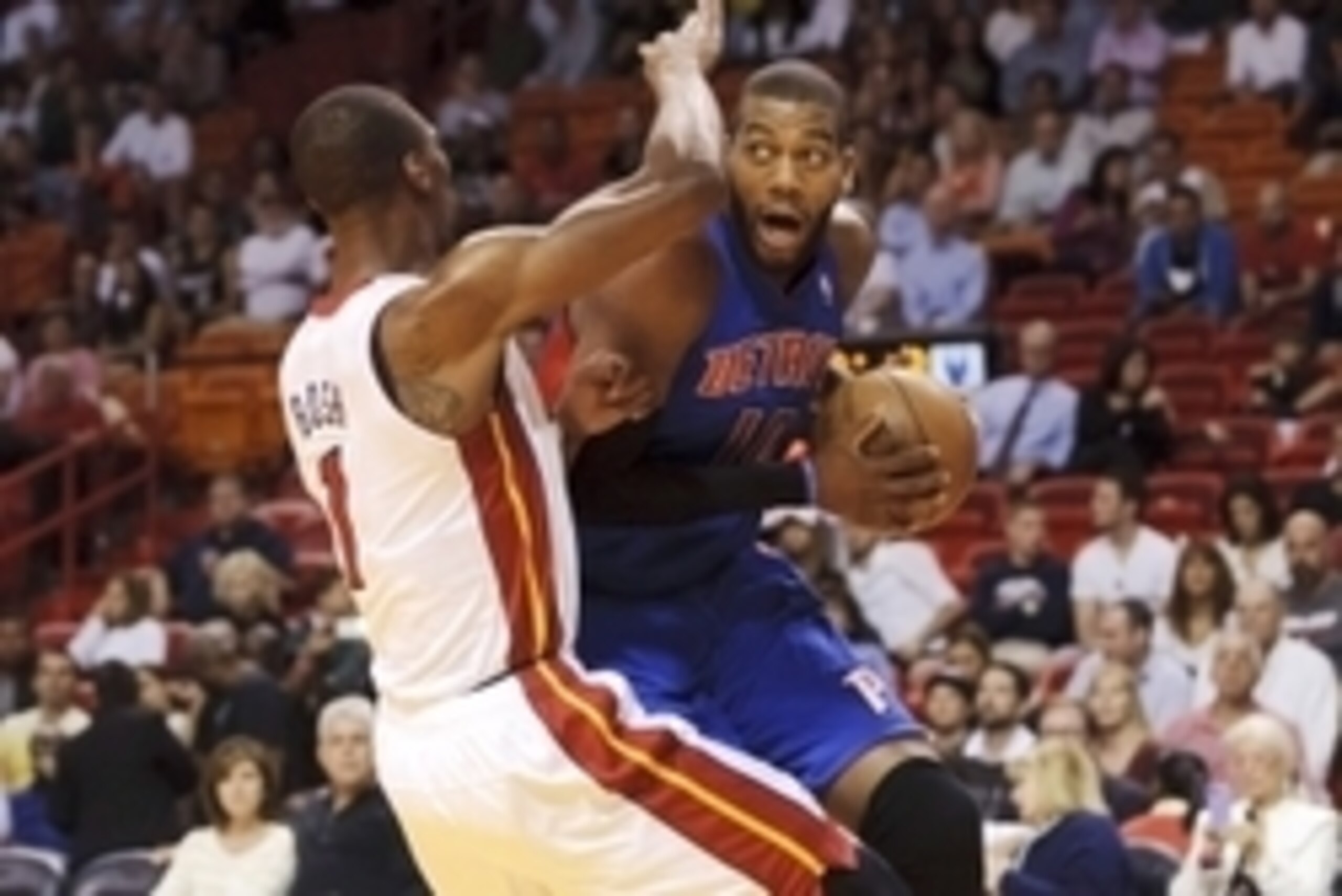 Mar 22, 2013; Miami, FL, USA; Detroit Pistons center Greg Monroe (10) drives to the basket as Miami Heat center Chris Bosh (1) defends during the first half at American Airlines Arena. Mandatory Credit: Steve Mitchell-USA TODAY Sports