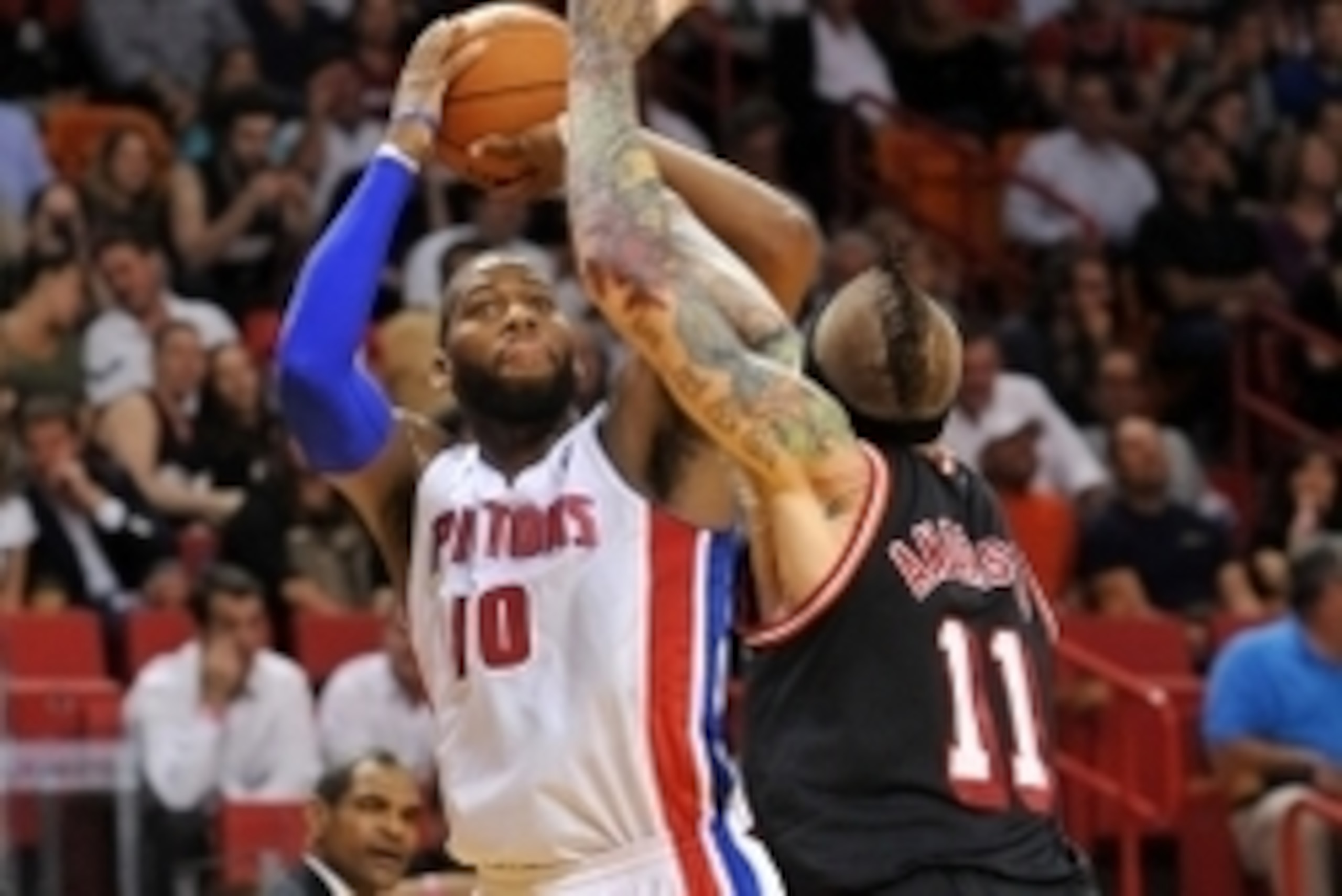 Feb 3, 2014; Miami, FL, USA; Detroit Pistons power forward Greg Monroe (10) is pressured by Miami Heat power forward Chris Andersen (11) during the first half at American Airlines Arena. Mandatory Credit: Steve Mitchell-USA TODAY Sports