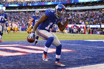 EAST RUTHERFORD, NJ - DECEMBER 14:  Odell Beckham Jr. #13 of the New York Giants celebrates after an attempted 30 yard touchdown that was nullified due to a penalty in the fourth quarter during their game against the Washington Redskins at MetLife Stadium