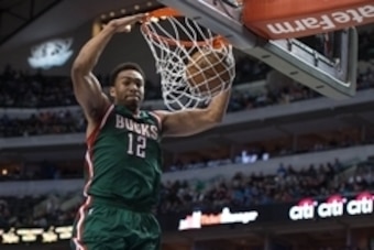 Dec 7, 2014; Dallas, TX, USA; Milwaukee Bucks forward Jabari Parker (12) dunks the ball during the second half against the Dallas Mavericks at the American Airlines Center. The Mavericks defeated the Bucks 125-102. Mandatory Credit: Jerome Miron-USA TODAY