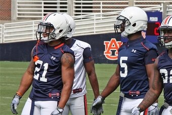 Robinson with former Auburn RB Tre Mason in 2012