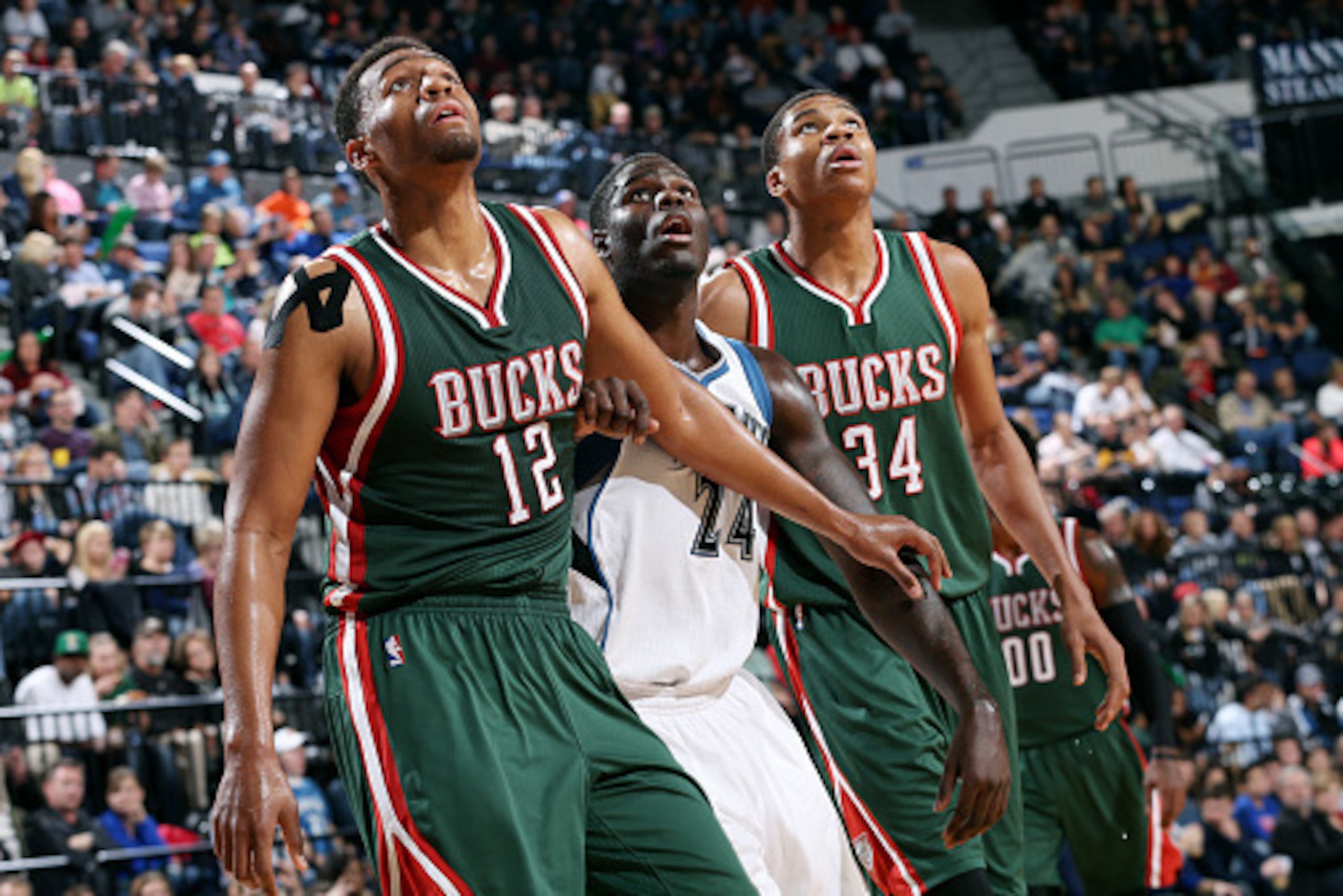 MINNEAPOLIS, MN - OCTOBER 17: Jabari Parker #12 and Giannis Antetokounmpo #34 of the Milwaukee Bucks battle for position against Anthony Bennett #24 of the Minnesota Timberwolves on October 17, 2014 at U.S. Cellular Center in Cedar Rapids, Iowa. NOTE TO U