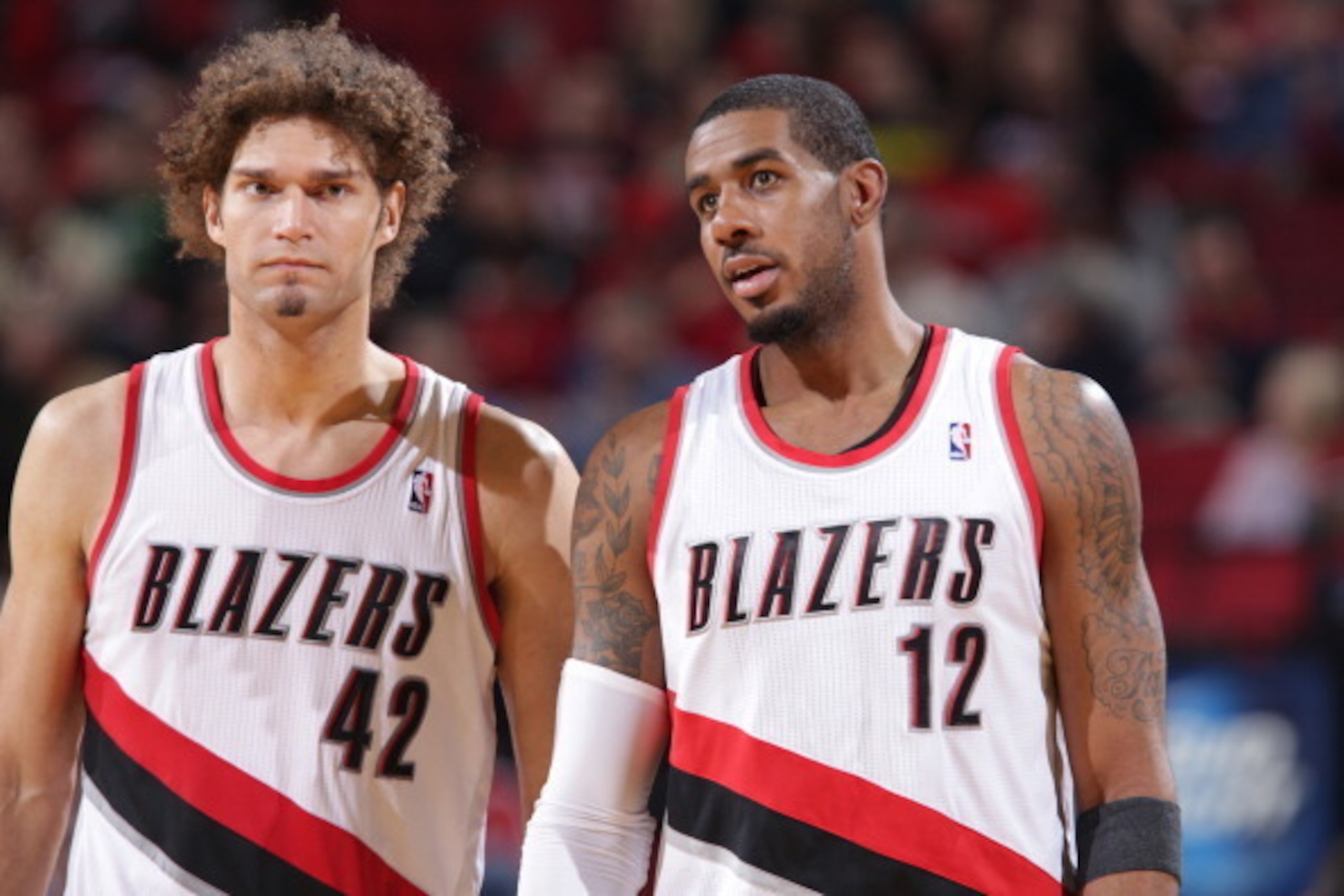 PORTLAND, OR - NOVEMBER 5:  Robin Lopez #42 and LaMarcus Aldridge #12 of the Portland Trail Blazers walk off the court against the Houston Rockets on November 5, 2013 at the Moda Center Arena in Portland, Oregon. NOTE TO USER: User expressly acknowledges 