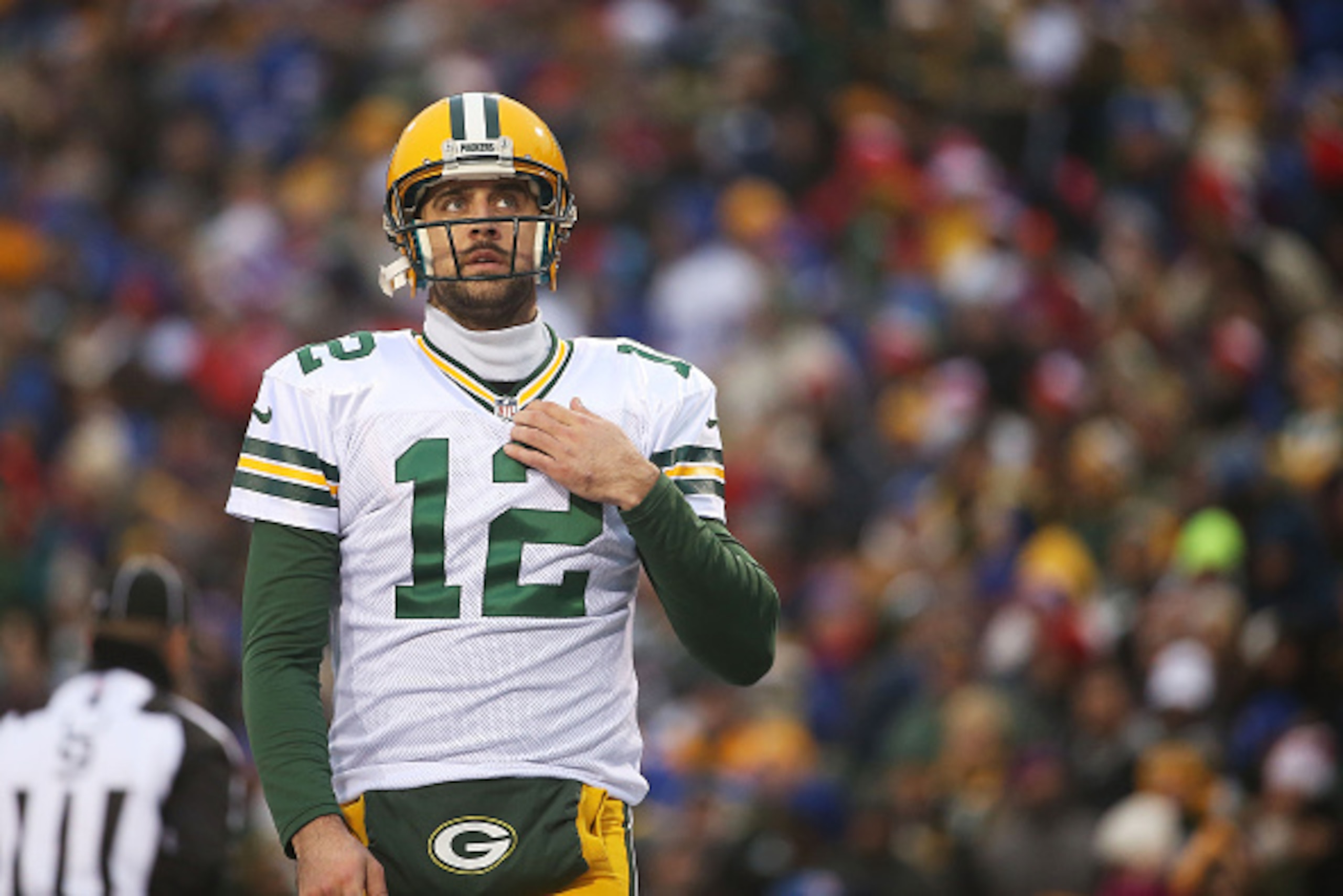 ORCHARD PARK, NY - DECEMBER 14:   Aaron Rodgers #12 of the Green Bay Packers looks at the clock against the Buffalo Bills during the second half at Ralph Wilson Stadium on December 14, 2014 in Orchard Park, New York.  (Photo by Tom Szczerbowski/Getty Imag