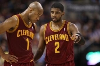Feb 21, 2014; Toronto, Ontario, CAN; Cleveland Cavaliers guard Kyrie Irving (2) talks to guard Jarrett Jack (1) against the Toronto Raptors at Air Canada Centre. The Raptors beat the Cavaliers 98-91. Mandatory Credit: Tom Szczerbowski-USA TODAY Sports