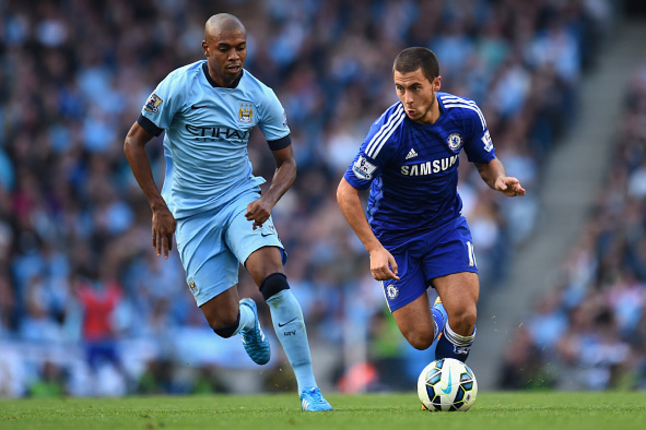 MANCHESTER, ENGLAND - SEPTEMBER 21:  Eden Hazard of Chelsea competes with Fernandinho of Manchester City during the Barclays Premier League match between Manchester City and Chelsea at the Etihad Stadium on September 21, 2014 in Manchester, England.  (Pho