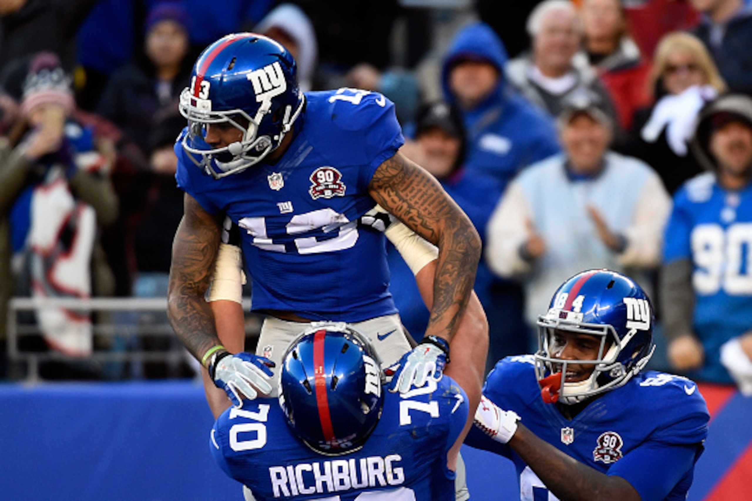 EAST RUTHERFORD, NJ - DECEMBER 14:  Odell Beckham Jr. #13 of the New York Giants celebrates with Weston Richburg #70 after scoring a 35 yard touchdown in the third quarter against the Washington Redskins during their game at MetLife Stadium on December 14