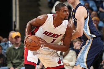 MEMPHIS, TN - DECEMBER 7:  Chris Bosh #1 of the Miami Heat handles the ball against the Memphis Grizzlies during the game on December 7, 2014 at FedExForum in Memphis, Tennessee. NOTE TO USER: User expressly acknowledges and agrees that, by downloading an
