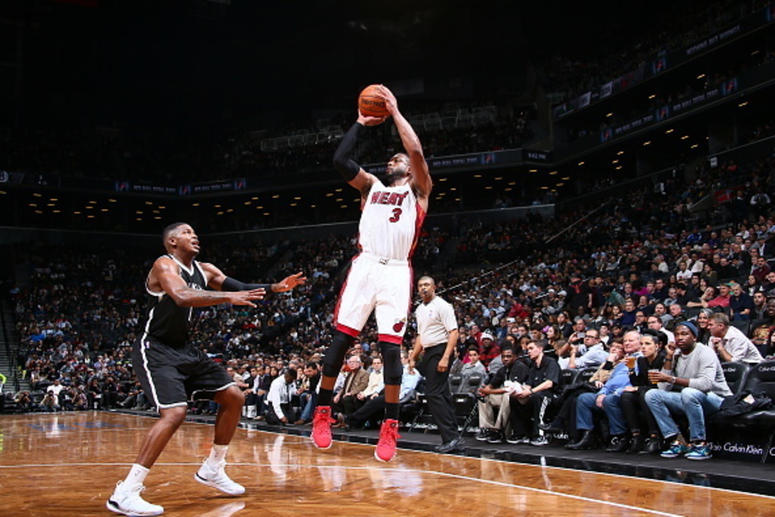 BROOKLYN, NY - DECEMBER 16: Dwyane Wade #3 of the Miami Heat shoots the ball against the Brooklyn Nets during the game on December 16, 2014 at Barclays Center in Brooklyn, New York. NOTE TO USER: User expressly acknowledges and agrees that, by downloadin BROOKLYN, NY - DECEMBER 16: Dwyane Wade #3 of the Miami Heat shoots the ball against the Brooklyn Nets during the game on December 16, 2014 at Barclays Center in Brooklyn, New York. NOTE TO USER: User expressly acknowledges and agrees that, by downloadin
