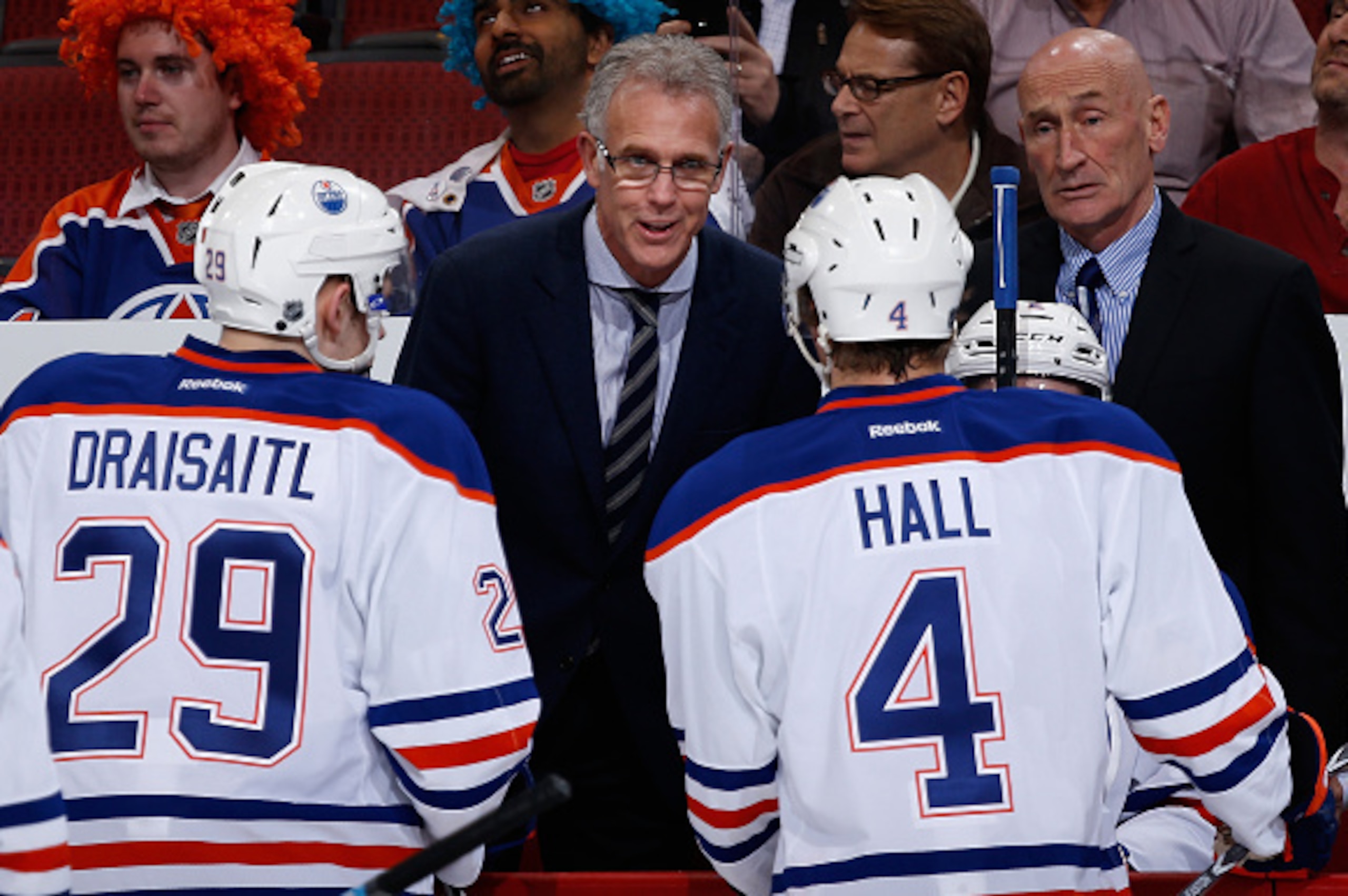 GLENDALE, AZ - DECEMBER 16:  General manager Craig MacTavish (C) of the Edmonton Oilers talks with Leon Draisaitl #29 and Taylor Hall #4 on the bench during the first period of the NHL game against the Arizona Coyotes at Gila River Arena on December 16, 2