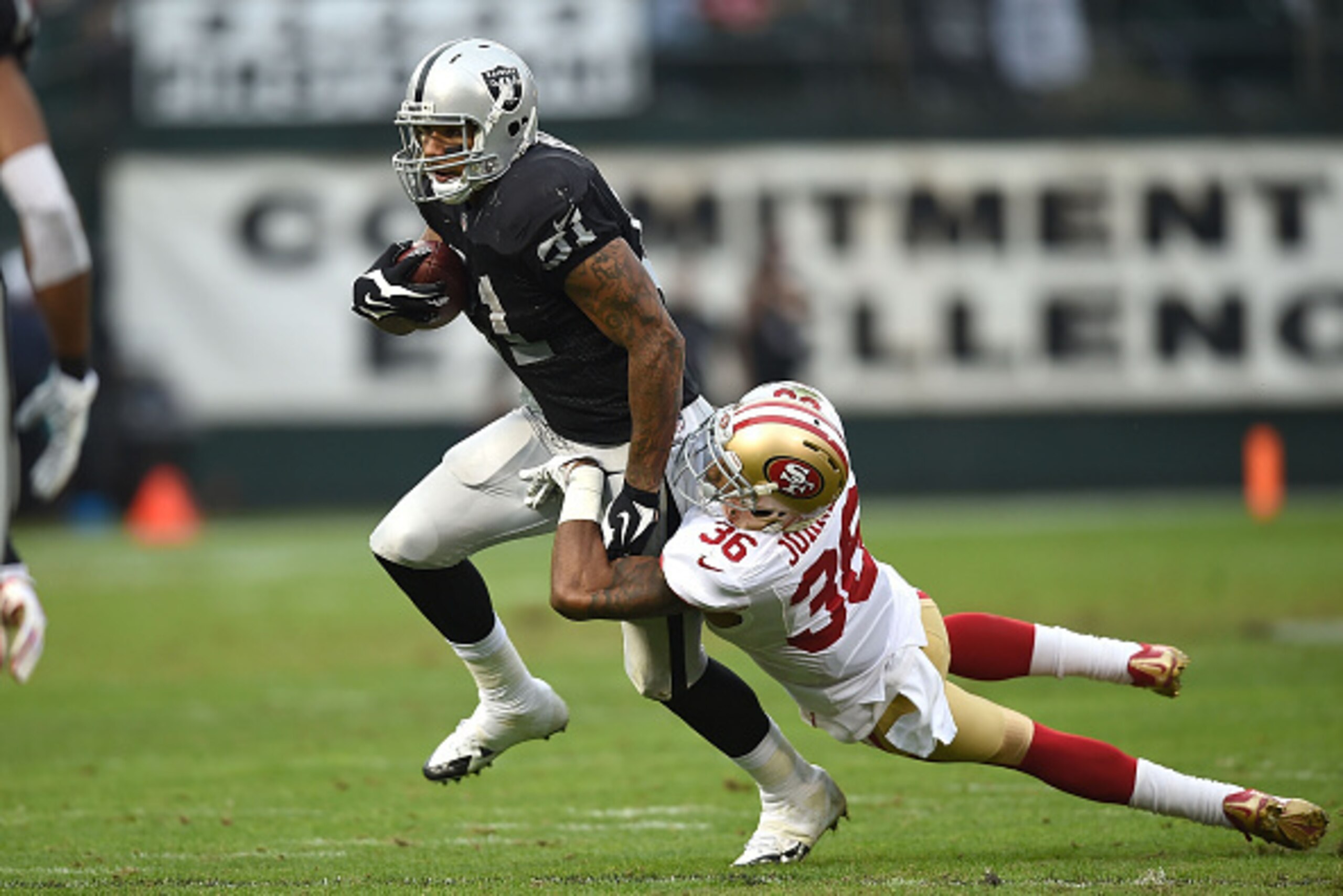 OAKLAND, CA - DECEMBER 07: Mychal Rivera #81 of the Oakland Raiders is caught by Dontae Johnson #36 of the San Francisco 49ers in the second half at O.co Coliseum on December 7, 2014 in Oakland, California. (Photo by Thearon W. Henderson/Getty Images) OAKLAND, CA - DECEMBER 07: Mychal Rivera #81 of the Oakland Raiders is caught by Dontae Johnson #36 of the San Francisco 49ers in the second half at O.co Coliseum on December 7, 2014 in Oakland, California. (Photo by Thearon W. Henderson/Getty Images)
