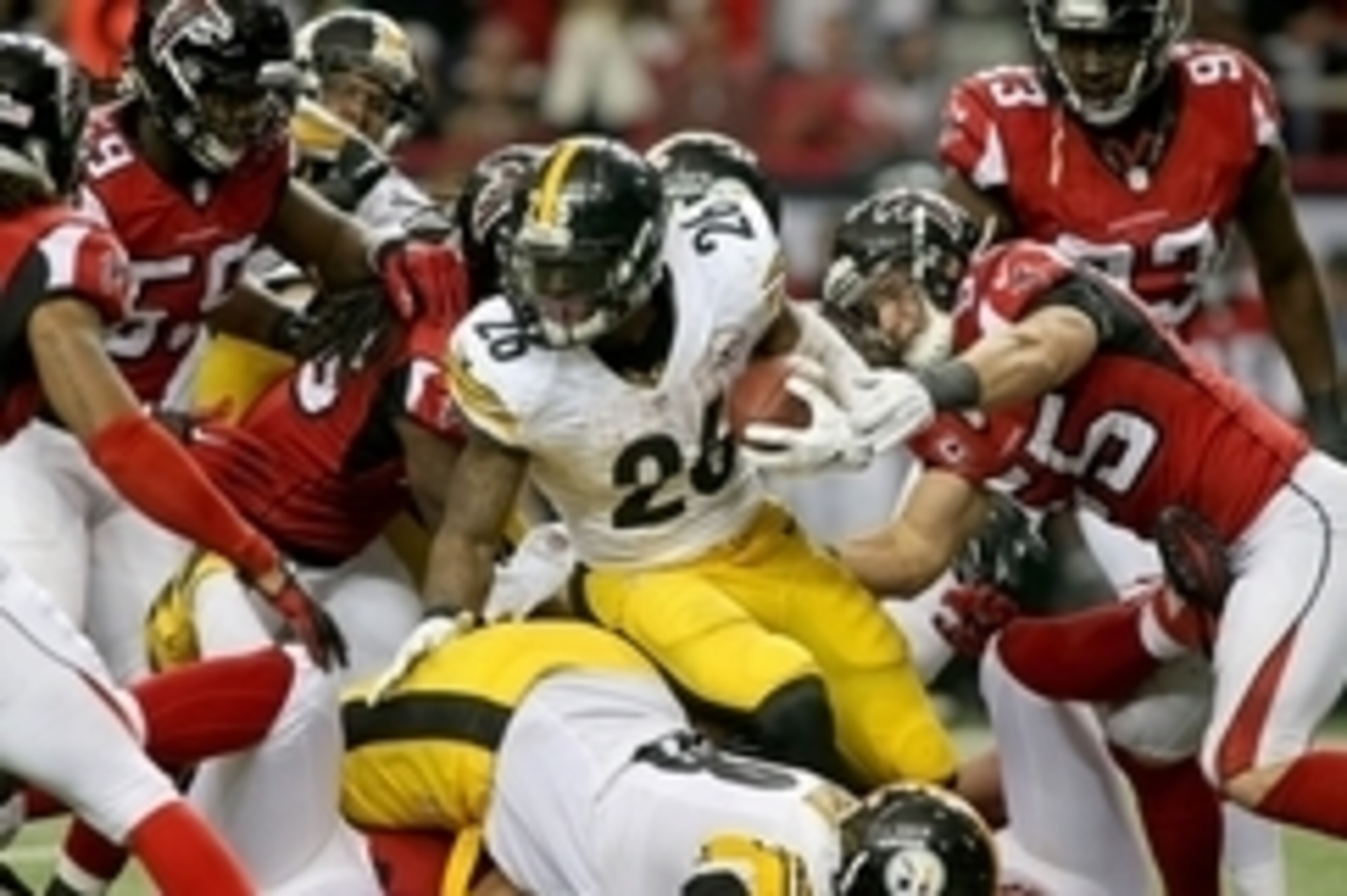 Dec 14, 2014; Atlanta, GA, USA; Pittsburgh Steelers running back Le'Veon Bell (26) fights for extra yards against Atlanta Falcons inside linebacker Paul Worrilow (55) and others in the fourth quarter of their game at the Georgia Dome. The Steelers won 27-
