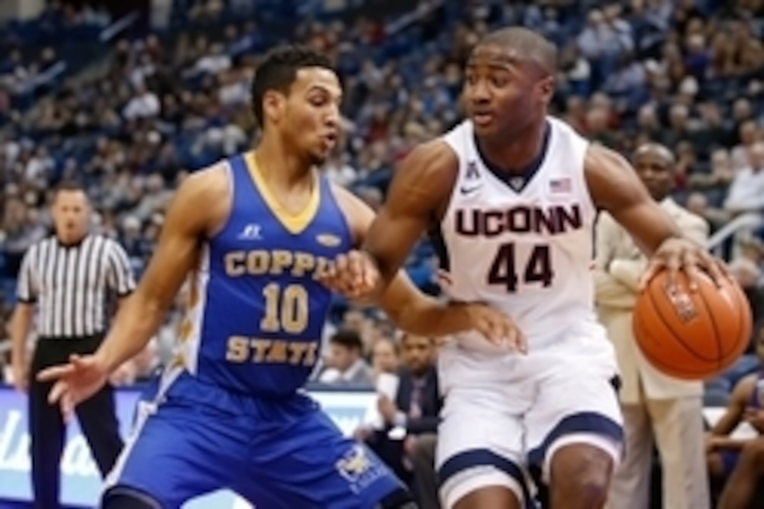 Dec 14, 2014; Hartford, CT, USA; Connecticut Huskies guard Rodney Purvis (44) works the ball against Coppin State Eagles guard Christian Kessee (10) in the first half at XL Center. UConn defeated Coppin State 106-85. Mandatory Credit: David Butler II-USA 