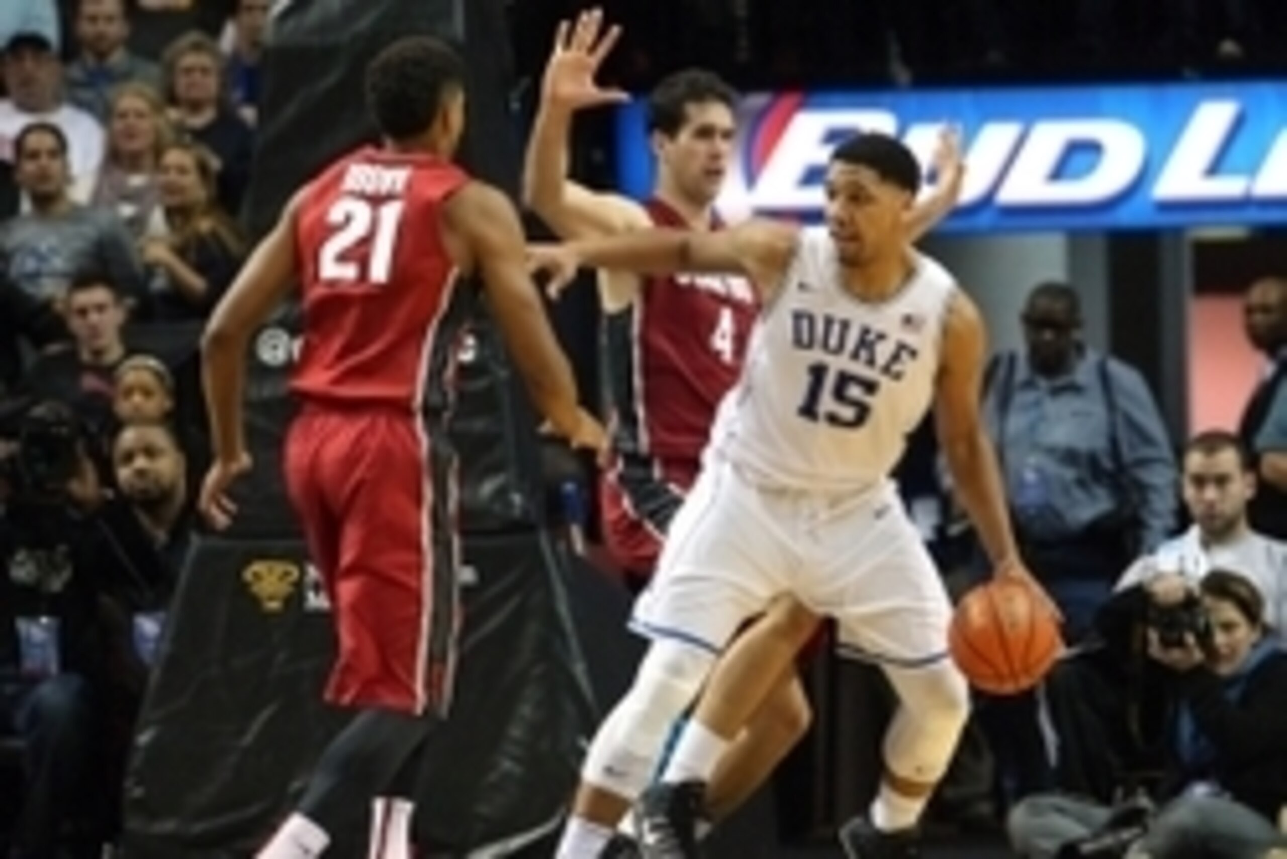 Nov 22, 2014; Brooklyn, NY, USA; Duke Blue Devils center Jahlil Okafor (15) controls the ball against Stanford Cardinal guard Anthony Brown (21) and Stanford Cardinal center Stefan Nastic (4) during the second half at Barclays Center. Duke defeated Stanfo