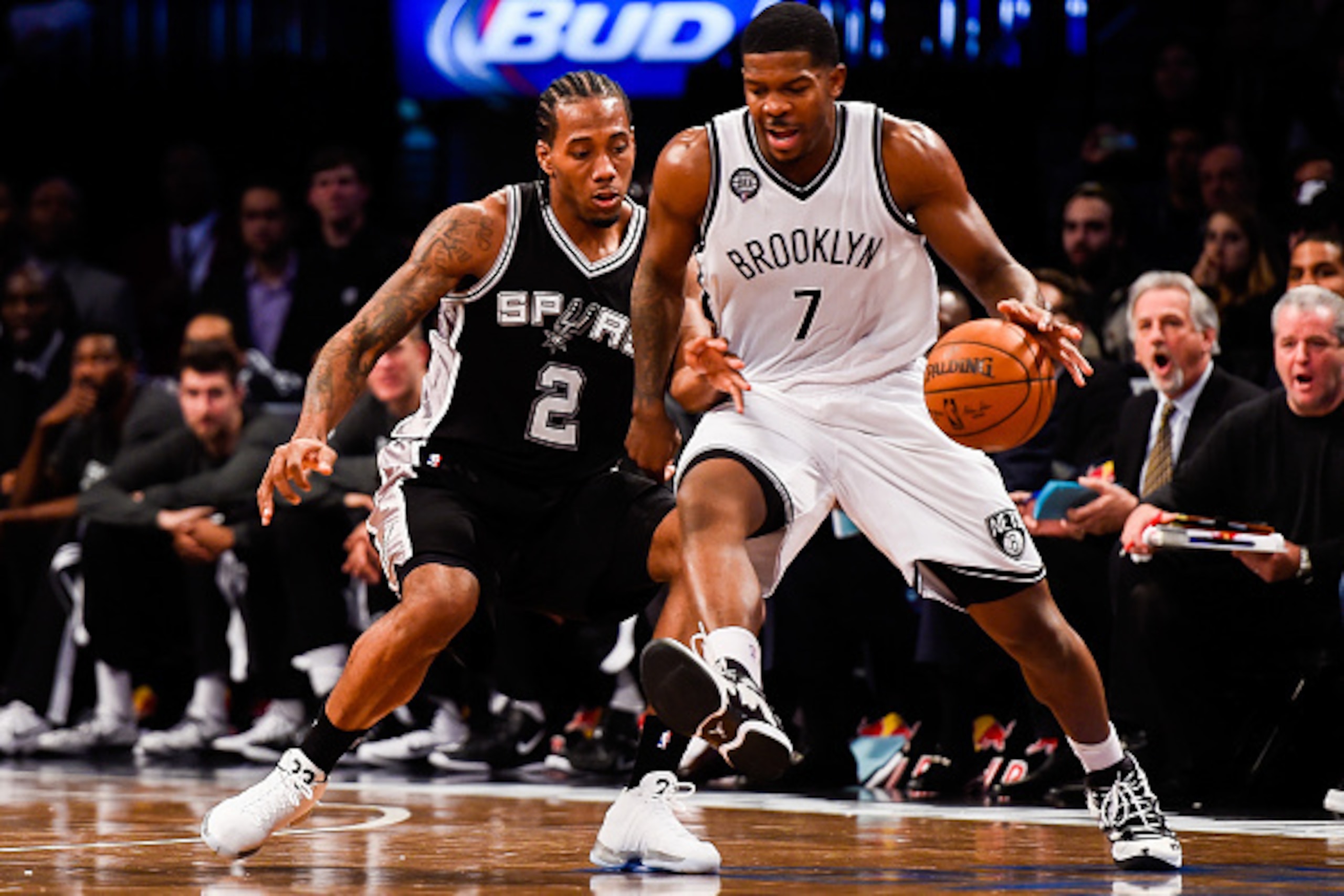 NEW YORK, NY - DECEMBER 03: Kawhi Leonard #2 of the San Antonio Spurs guards Joe Johnson #7 of the Brooklyn Nets at the Barclays Center on December 3, 2014 in the Brooklyn borough of New York City. NOTE TO USER: User expressly acknowledges and agrees that