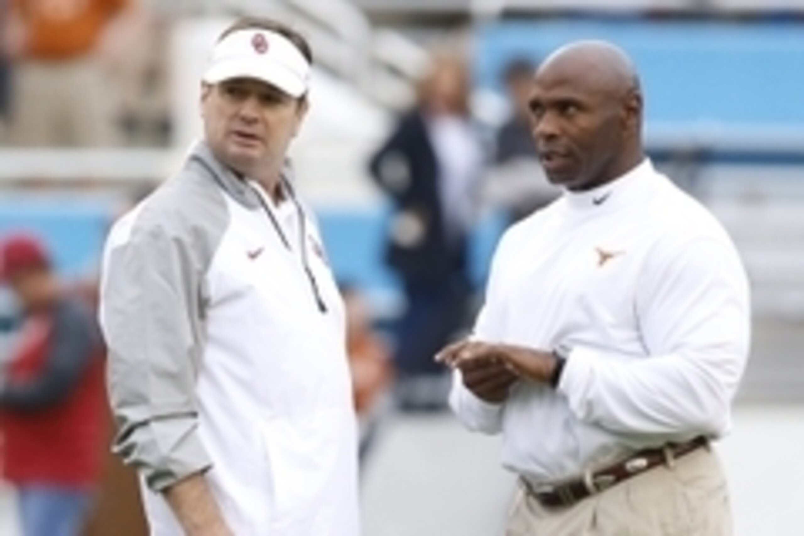 Oct 11, 2014; Dallas, TX, USA; Oklahoma Sooners head coach Bob Stoops (L) talks with Texas Longhorns head coach Charlie Strong before the game at the Cotton Bowl. Mandatory Credit: Tim Heitman-USA TODAY Sports Oct 11, 2014; Dallas, TX, USA; Oklahoma Sooners head coach Bob Stoops (L) talks with Texas Longhorns head coach Charlie Strong before the game at the Cotton Bowl. Mandatory Credit: Tim Heitman-USA TODAY Sports