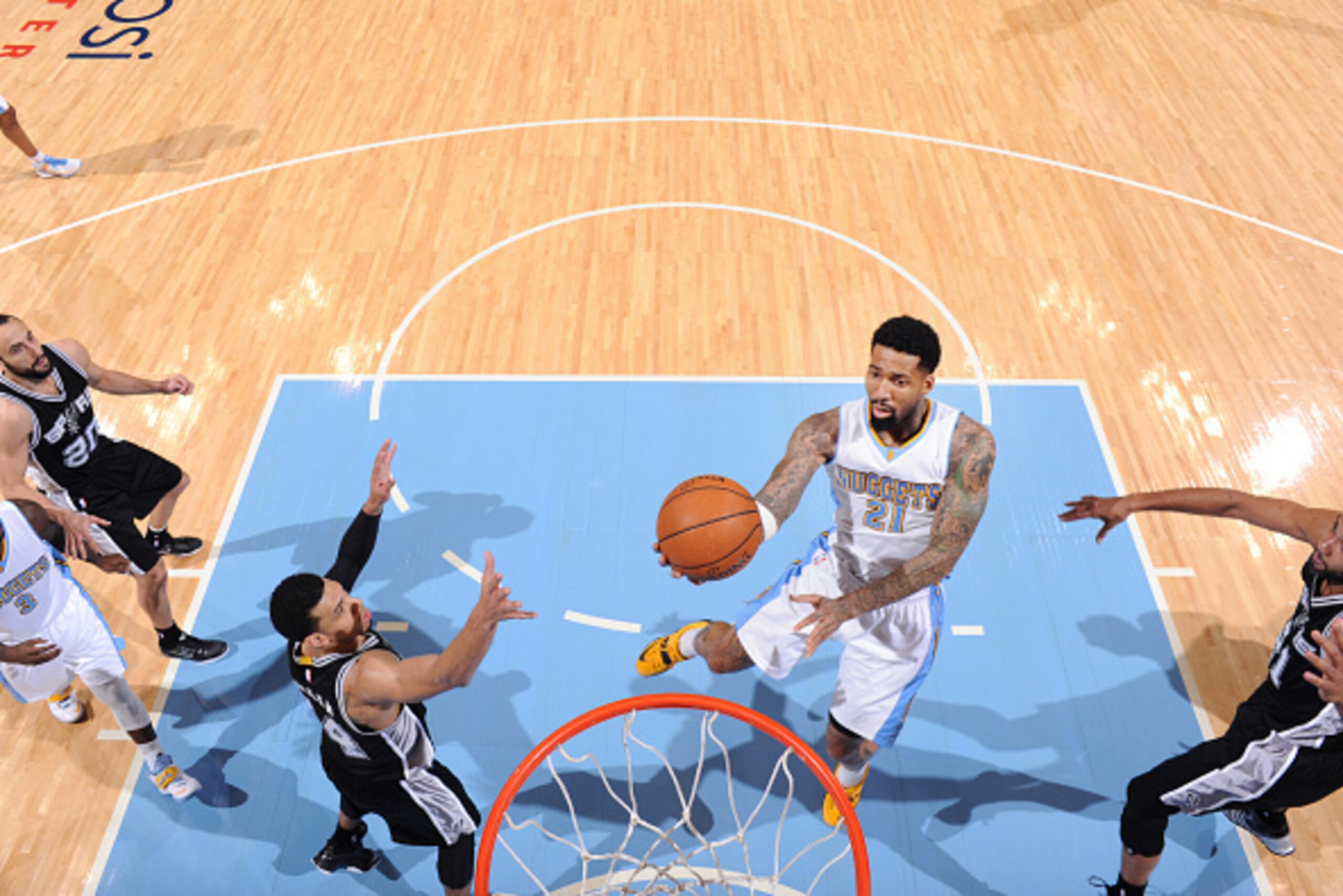 DENVER, CO - December 14: Wilson Chandler #21 of the Denver Nuggets goes for the lay up against the San Antonio Spurs during the game on December 14, 2014 at Pepsi Center in Denver, Colorado. NOTE TO USER: User expressly acknowledges and agrees that, by d