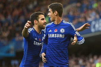 LONDON, ENGLAND - NOVEMBER 01:  Oscar of Chelsea celebrates his goal with Cesc Fabregas during the Barclays Premier League match between Chelsea and Queens Park Rangers at Stamford Bridge on November 1, 2014 in London, England.  (Photo by Mike Hewitt/Gett