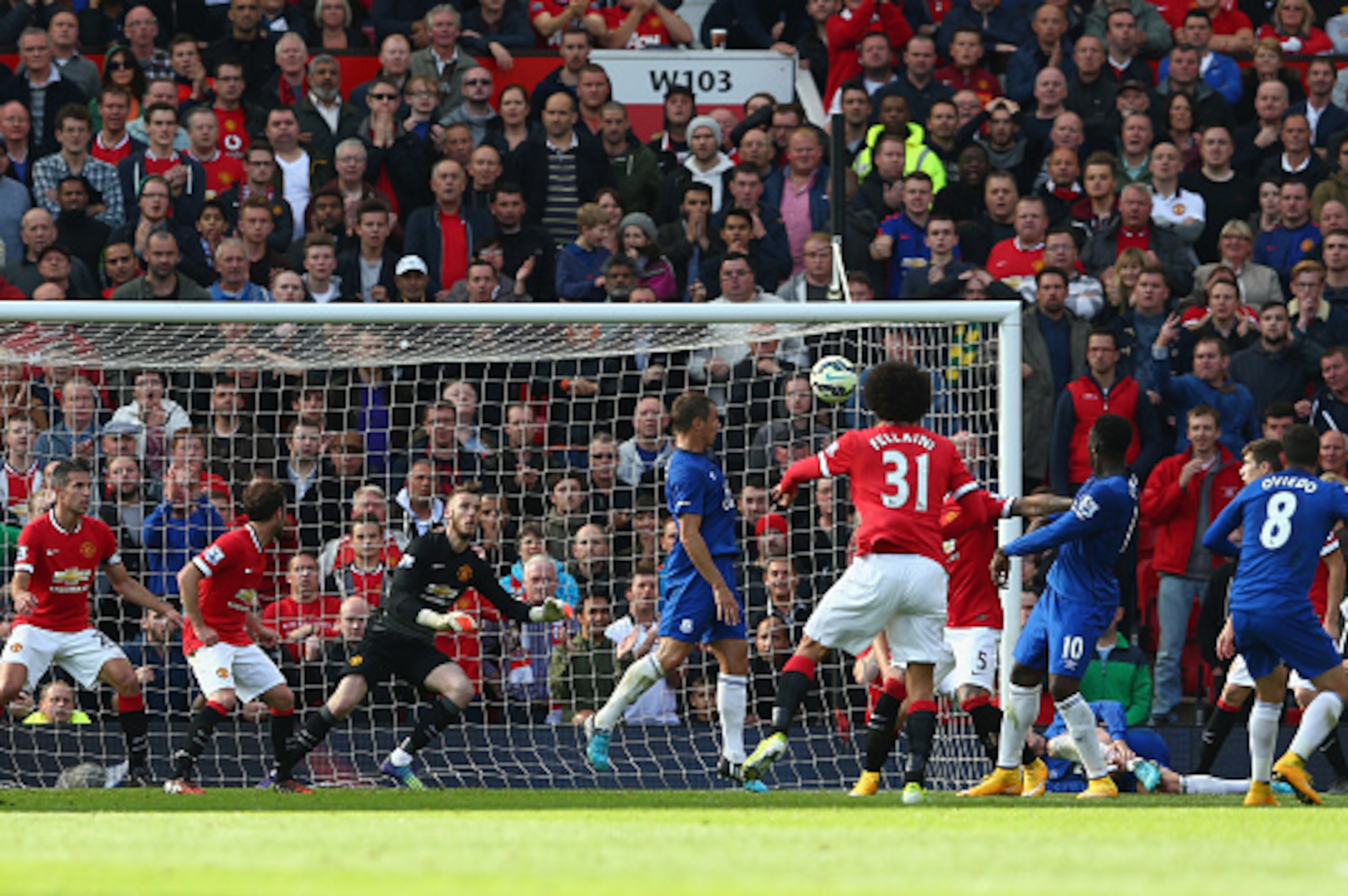 MANCHESTER, ENGLAND - OCTOBER 05:  David De Gea of Manchester United saves the shot of Bryan Oviedo of Everton during the Barclays Premier League match between Manchester United and Everton at Old Trafford on October 5, 2014 in Manchester, England.  (Phot
