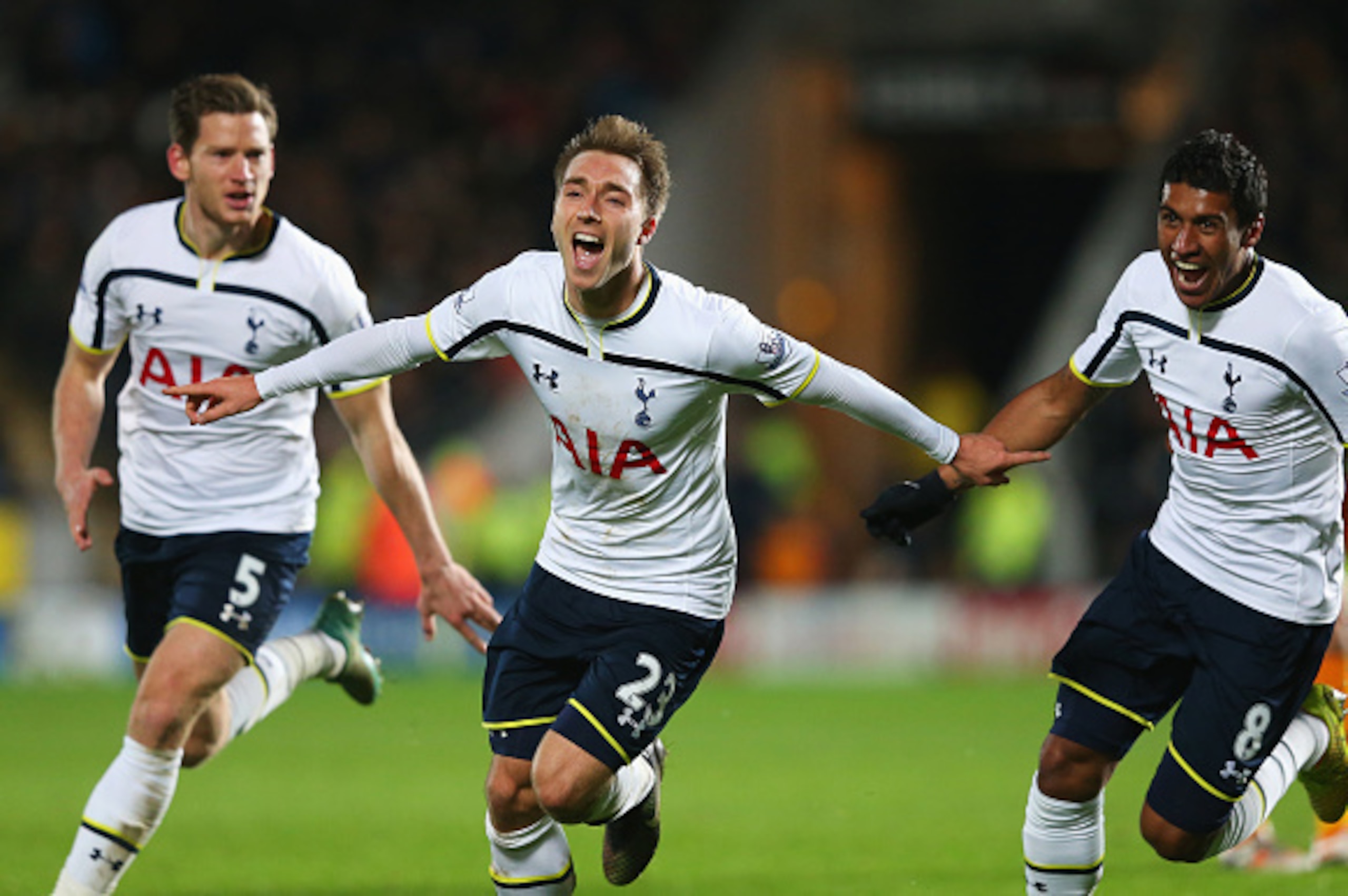 HULL, ENGLAND - NOVEMBER 23: Christian Eriksen of Tottenham Hotspur celebrates scoring the winning goal with Jan Vertonghen (L) and Paulinho during the Barclays Premier League match between Hull City and Tottenham Hotspur at KC Stadium on November 23, 20 HULL, ENGLAND - NOVEMBER 23: Christian Eriksen of Tottenham Hotspur celebrates scoring the winning goal with Jan Vertonghen (L) and Paulinho during the Barclays Premier League match between Hull City and Tottenham Hotspur at KC Stadium on November 23, 20