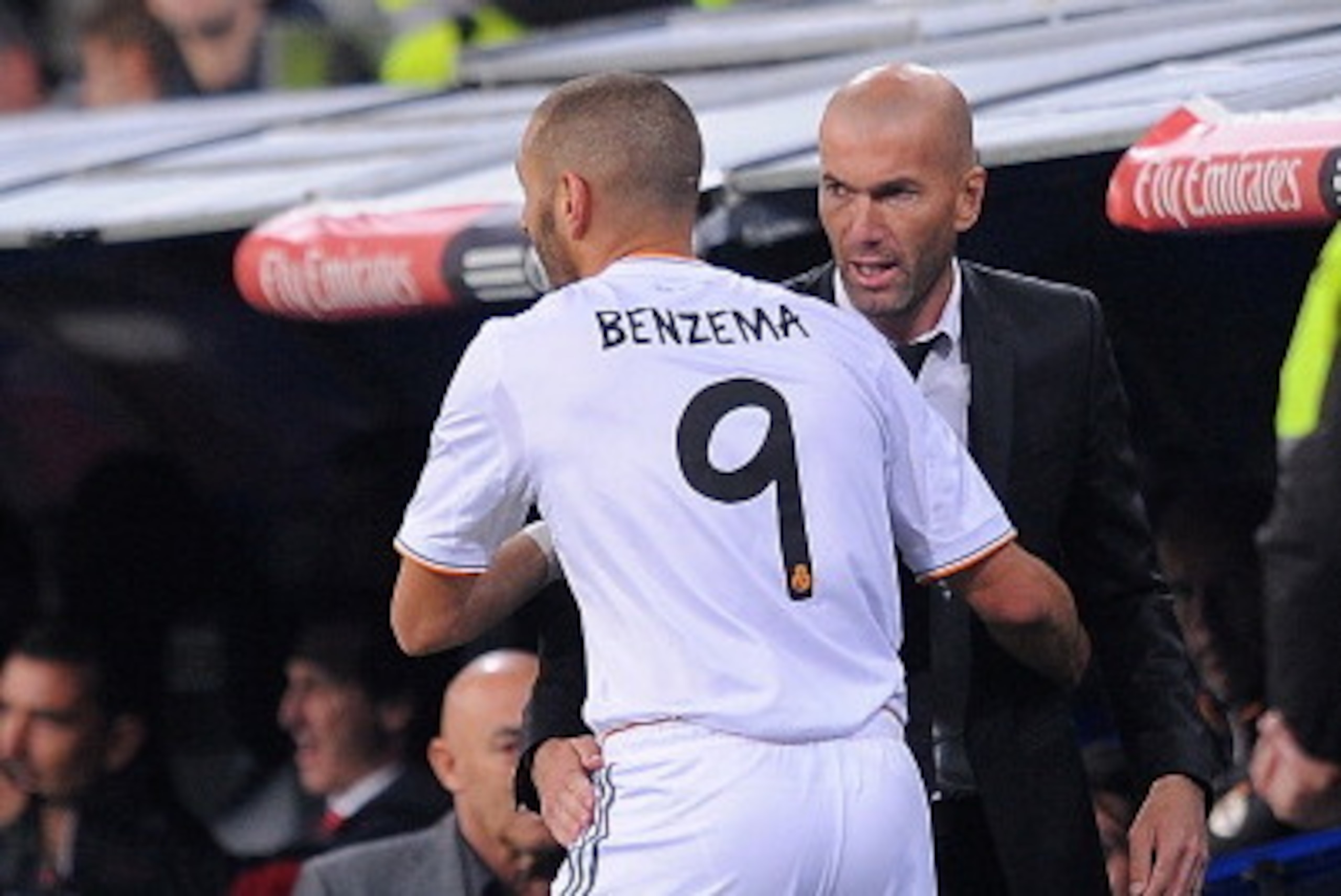 MADRID, SPAIN - OCTOBER 30: Karim Benzema of Real Madrid CF celebrates with assistant coach and former Real player Zinedine Zidane after scoring Real's 4th goal during the La Liga match between Real Madrid CF and Sevilla FC at the Santiago Bernabeu Stadi MADRID, SPAIN - OCTOBER 30: Karim Benzema of Real Madrid CF celebrates with assistant coach and former Real player Zinedine Zidane after scoring Real's 4th goal during the La Liga match between Real Madrid CF and Sevilla FC at the Santiago Bernabeu Stadi