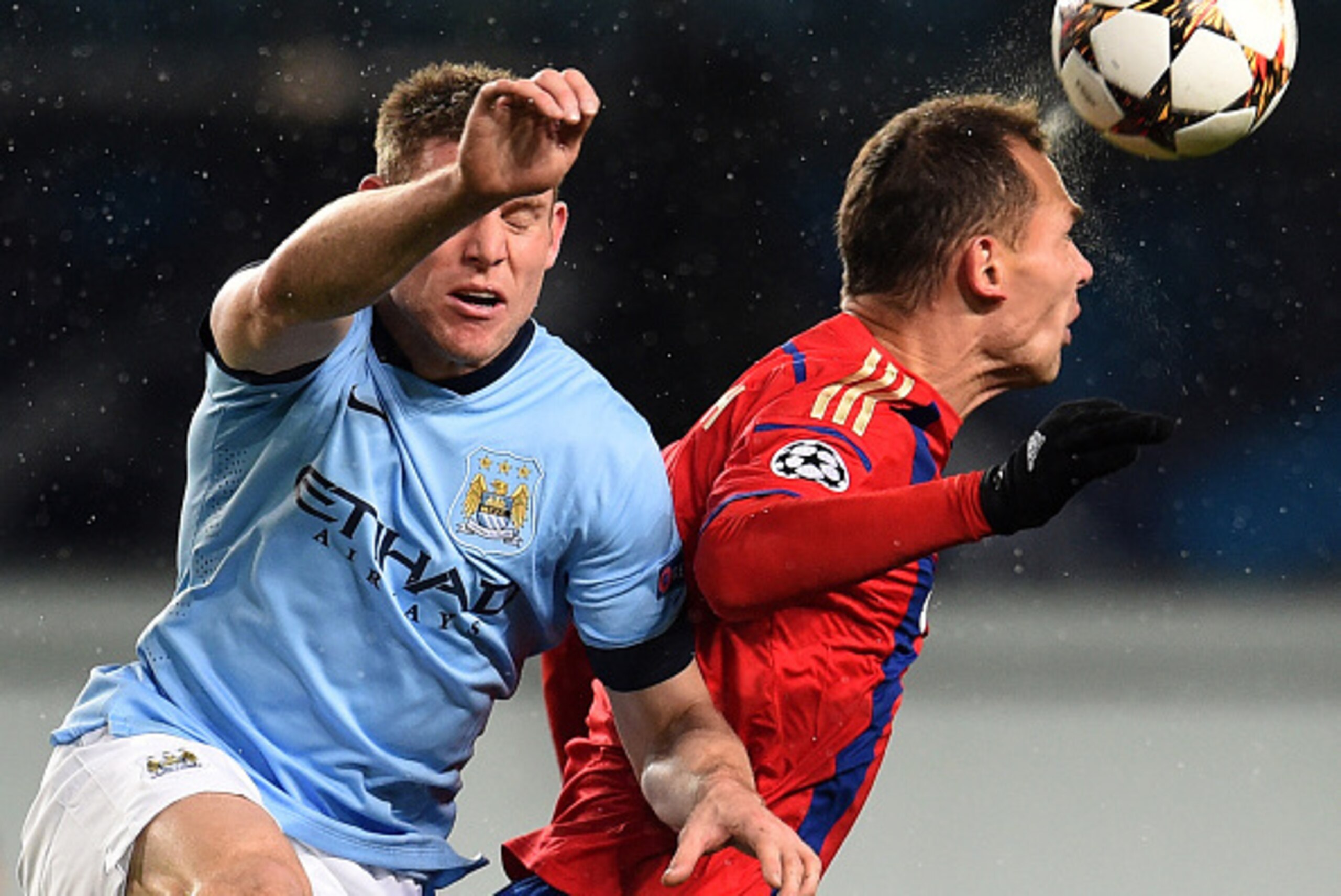 KHIMKI, RUSSIA - OCTOBER 21: Sergei Ignashevich (R) of PFC CSKA Moscow challenged by James Milner of Manchester City FC during the UEFA Champions League Group E match between PFC CSKA Moscow and Manchester City FC at the Arena Khimki Stadium on October 21