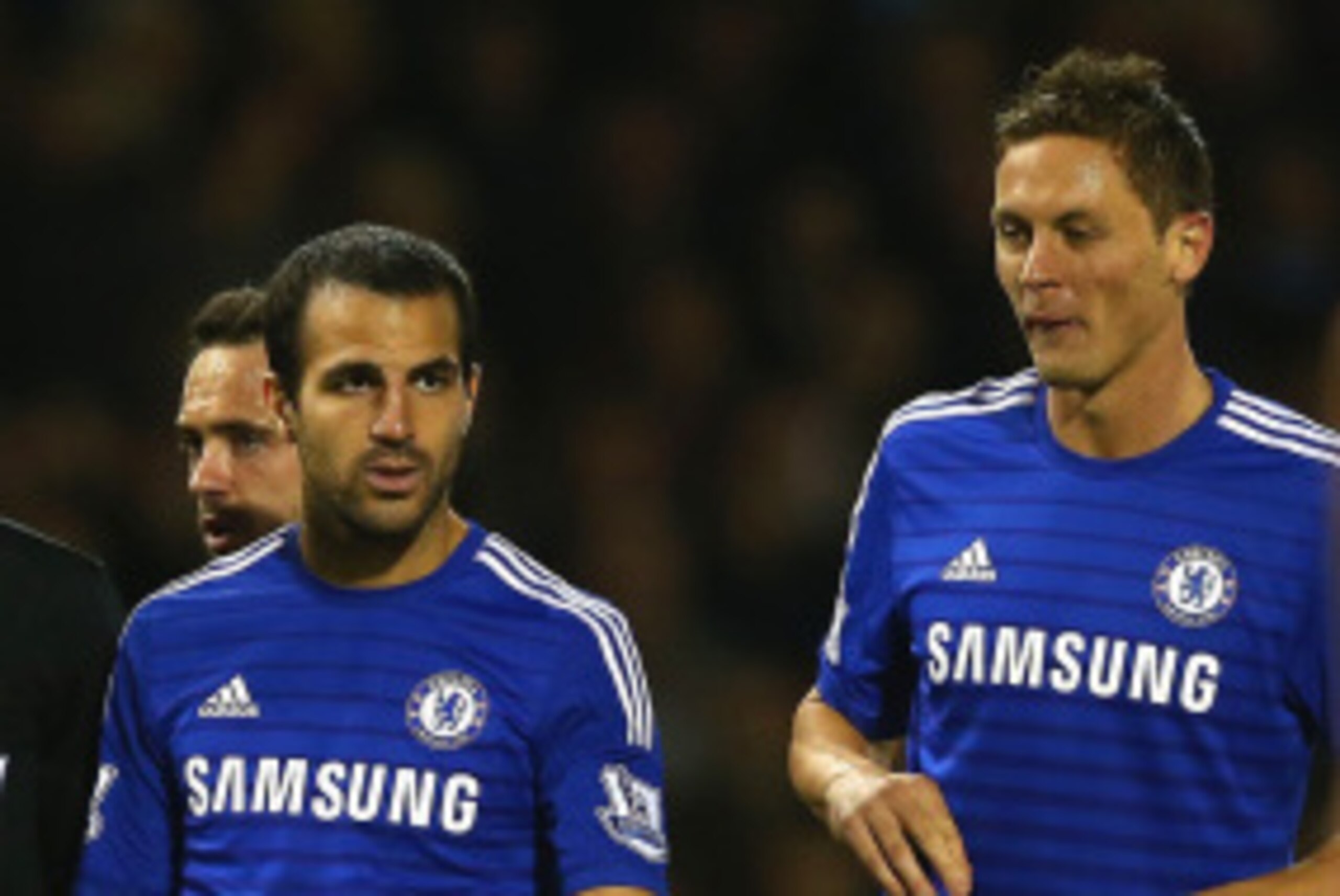 BURNLEY, ENGLAND - AUGUST 18:   Referee Michael Oliver speaks to Cesc Fabregas and Nemanja Matic of Chelsea during the Barclays Premier League match between Burnley and Chelsea at Turf Moor on August 18, 2014 in Burnley, England.  (Photo by Clive Brunskil