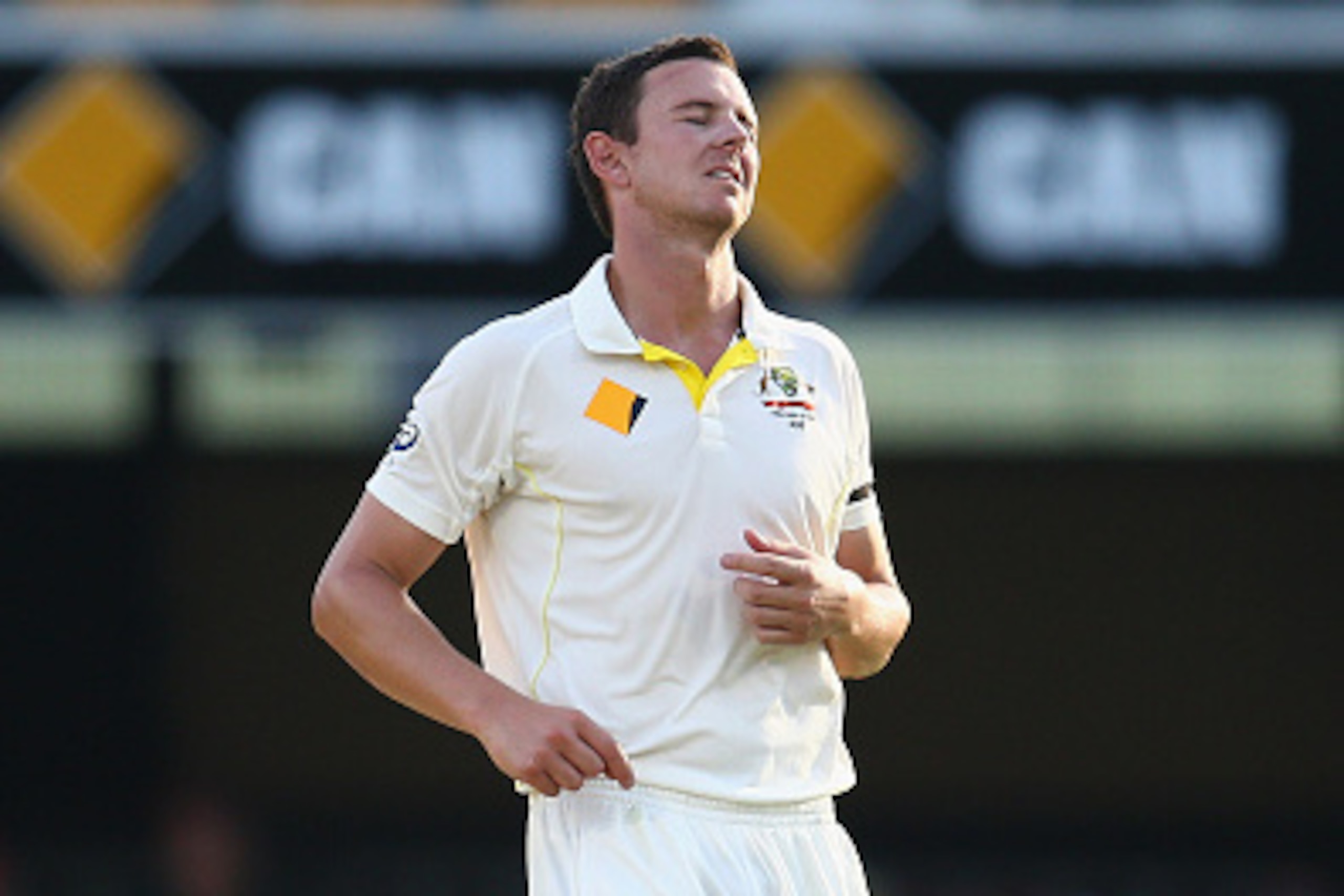BRISBANE, AUSTRALIA - DECEMBER 17: Josh Hazlewood of Australia pulls up short after bowling a ball during day one of the 2nd Test match between Australia and India at The Gabba on December 17, 2014 in Brisbane, Australia.  (Photo by Cameron Spencer/Getty 