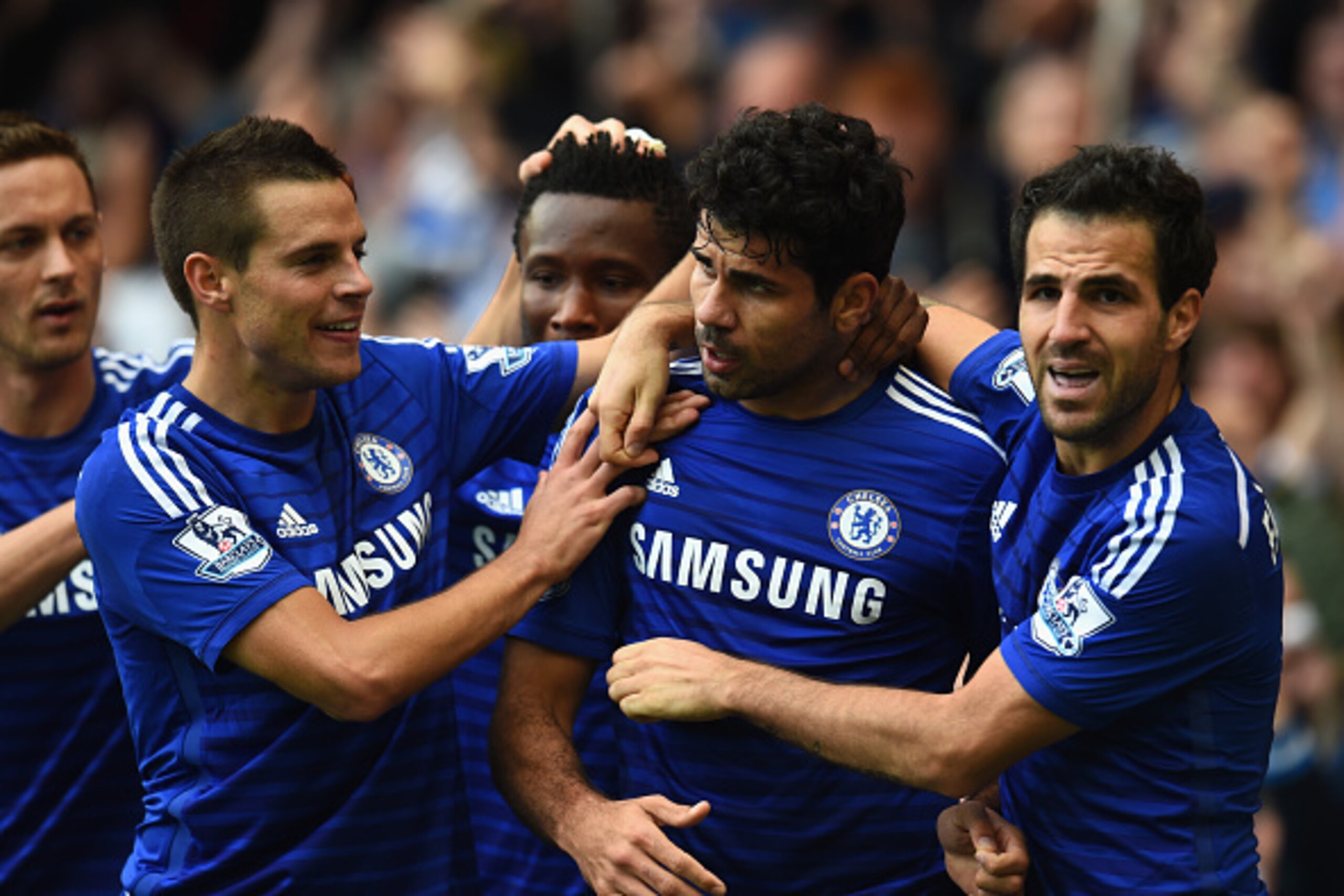 LONDON, ENGLAND - OCTOBER 05: Diego Costa of Chelsea celebrates scoring their second goal with Cesar Azpilicueta and Cesc Fabregas of Chelsea during the Barclays Premier League match between Chelsea and Arsenal at Stamford Bridge on October 4, 2014 in Lo LONDON, ENGLAND - OCTOBER 05: Diego Costa of Chelsea celebrates scoring their second goal with Cesar Azpilicueta and Cesc Fabregas of Chelsea during the Barclays Premier League match between Chelsea and Arsenal at Stamford Bridge on October 4, 2014 in Lo