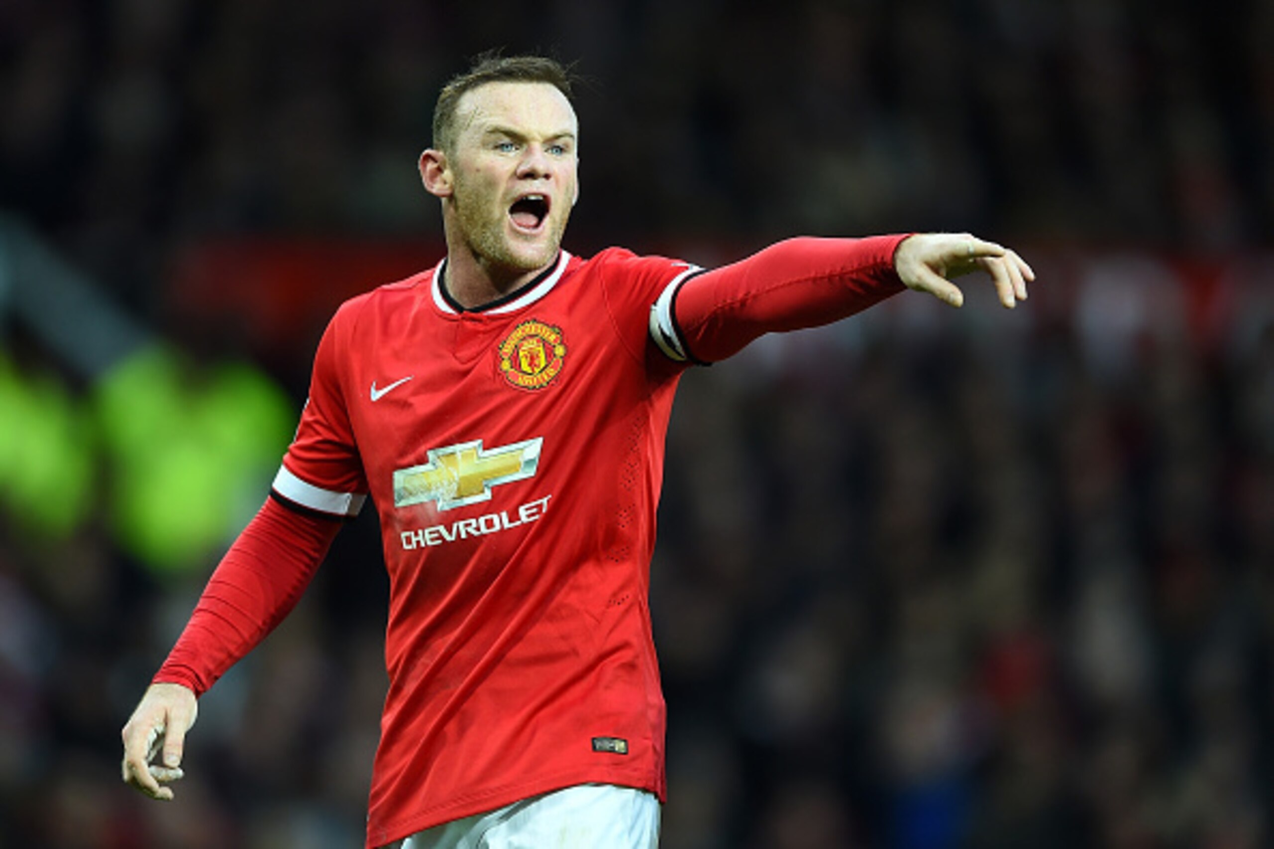 MANCHESTER, ENGLAND - DECEMBER 14:   Wayne Rooney of Manchester United gestures during the Barclays Premier League match between Manchester United and Liverpool at Old Trafford on December 14, 2014 in Manchester, England.  (Photo by Shaun Botterill/Getty 