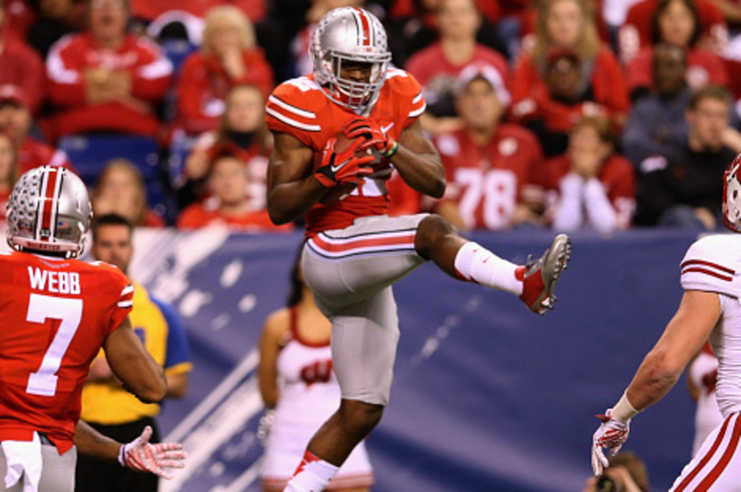 INDIANAPOLIS, IN - DECEMBER 06:  Doran Grant #12 of the Ohio State Buckeyes makes an interception in the fourth quarter against the Wisconsin Badgers during the Big Ten Championship at Lucas Oil Stadium on December 6, 2014 in Indianapolis, Indiana.  (Phot