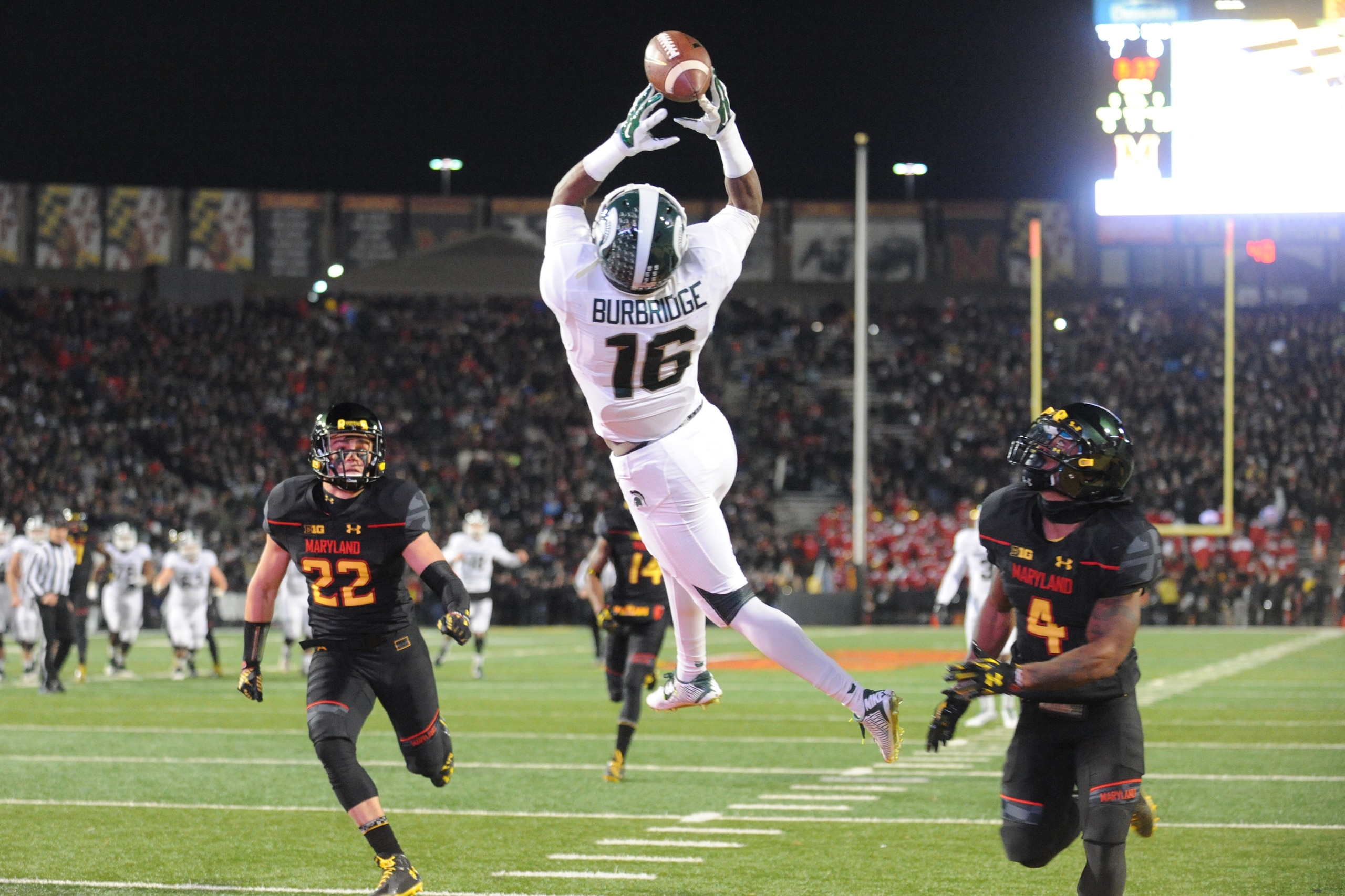 COLLEGE PARK, MD - NOVEMBER 15:  Aaron Burbridge #16 of the Michigan State Spartans can not hold on to a throw from Connor Cook #18 (not pictured) during a college football game against the Maryland Terrapins at Byrd Stadium on November 15, 2014 in Colleg