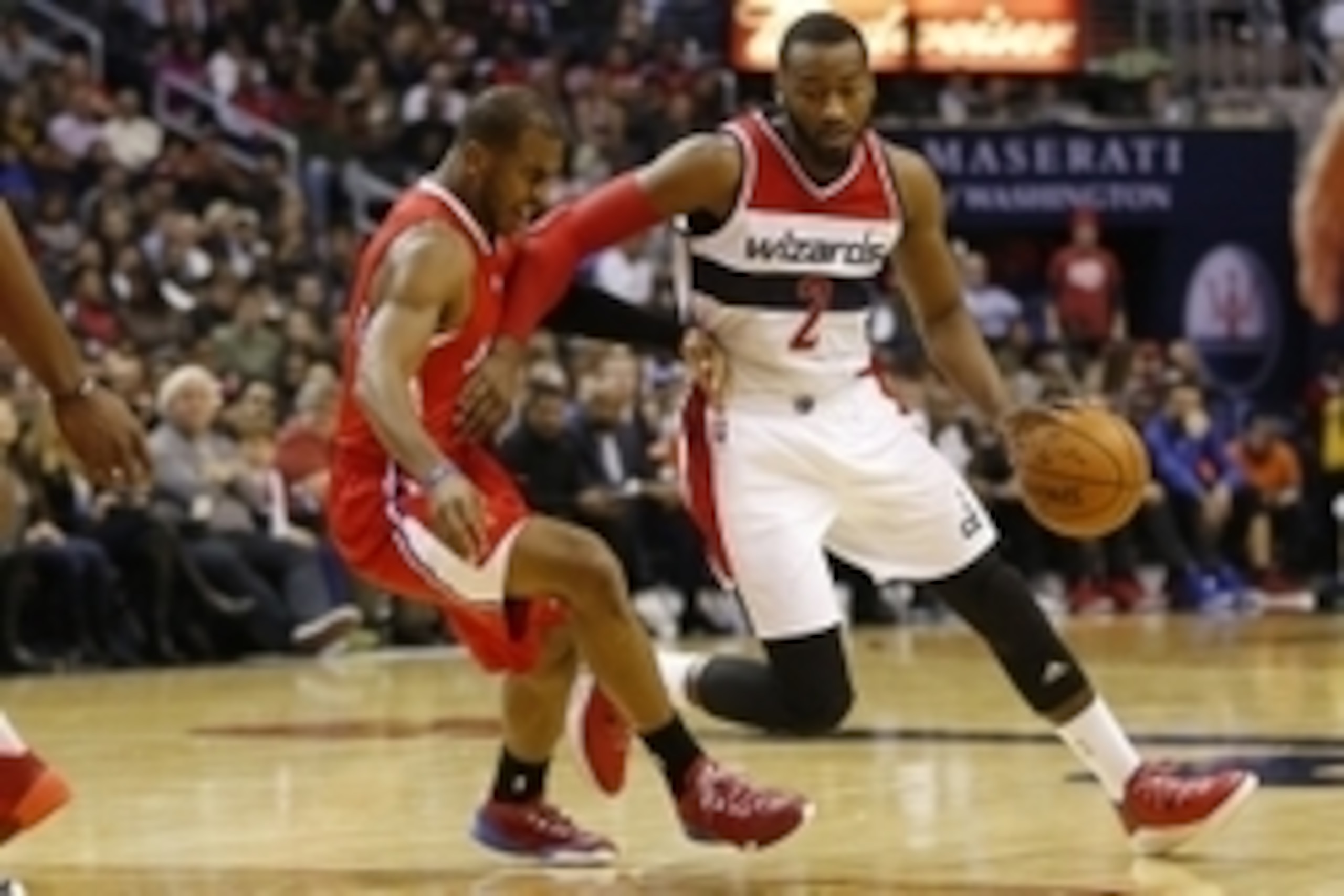 Dec 12, 2014; Washington, DC, USA; Washington Wizards guard John Wall (2) dribbles the ball as Los Angeles Clippers guard Chris Paul (3) defends in the second quarter at Verizon Center. Mandatory Credit: Geoff Burke-USA TODAY Sports