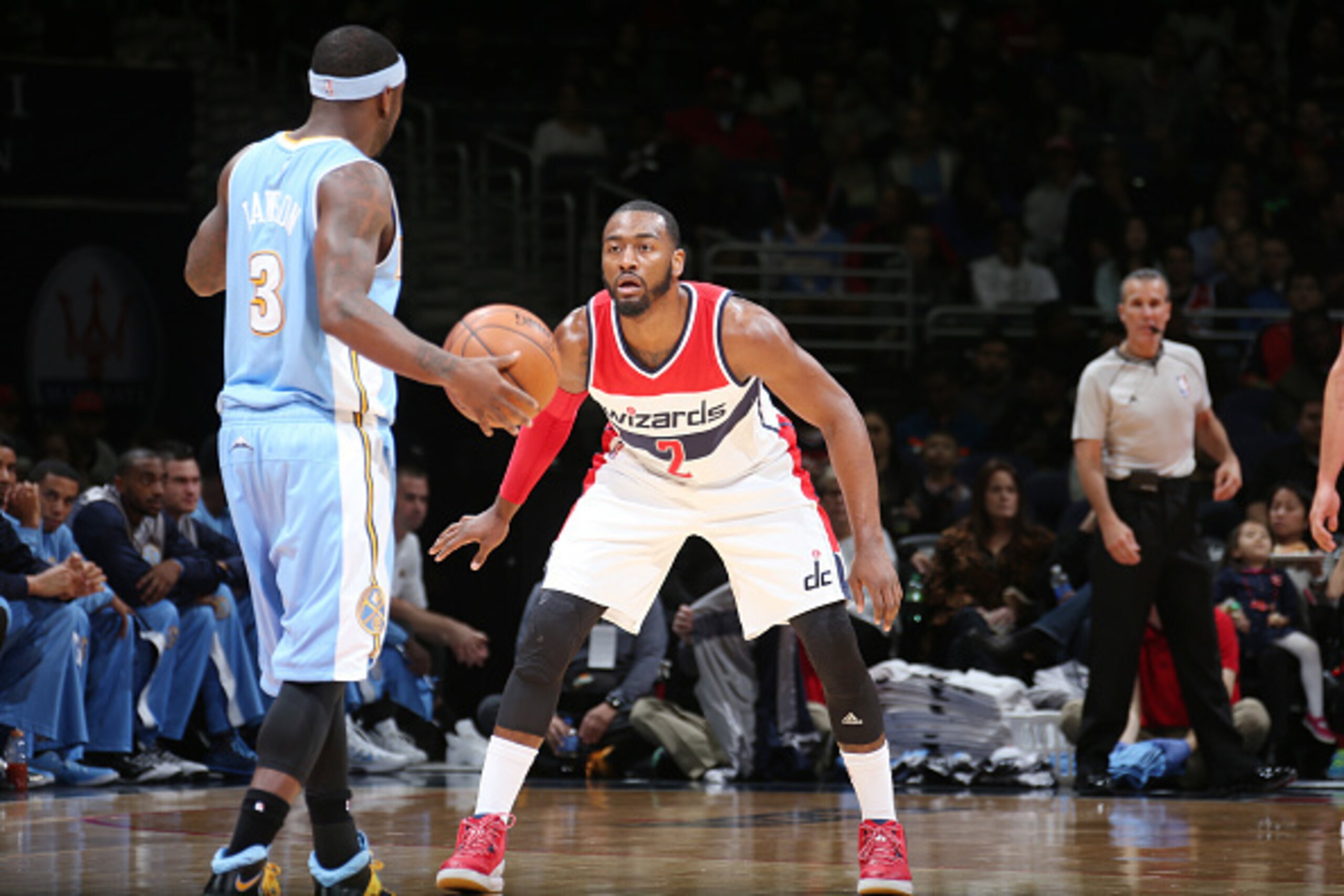 WASHINGTON, DC -  DECEMBER 5: John Wall #2 of the Washington Wizards defends the basket against Ty Lawson #3 of the Denver Nuggets during the game on December 5, 2014 at Verizon Center in Washington, DC. NOTE TO USER: User expressly acknowledges and agree