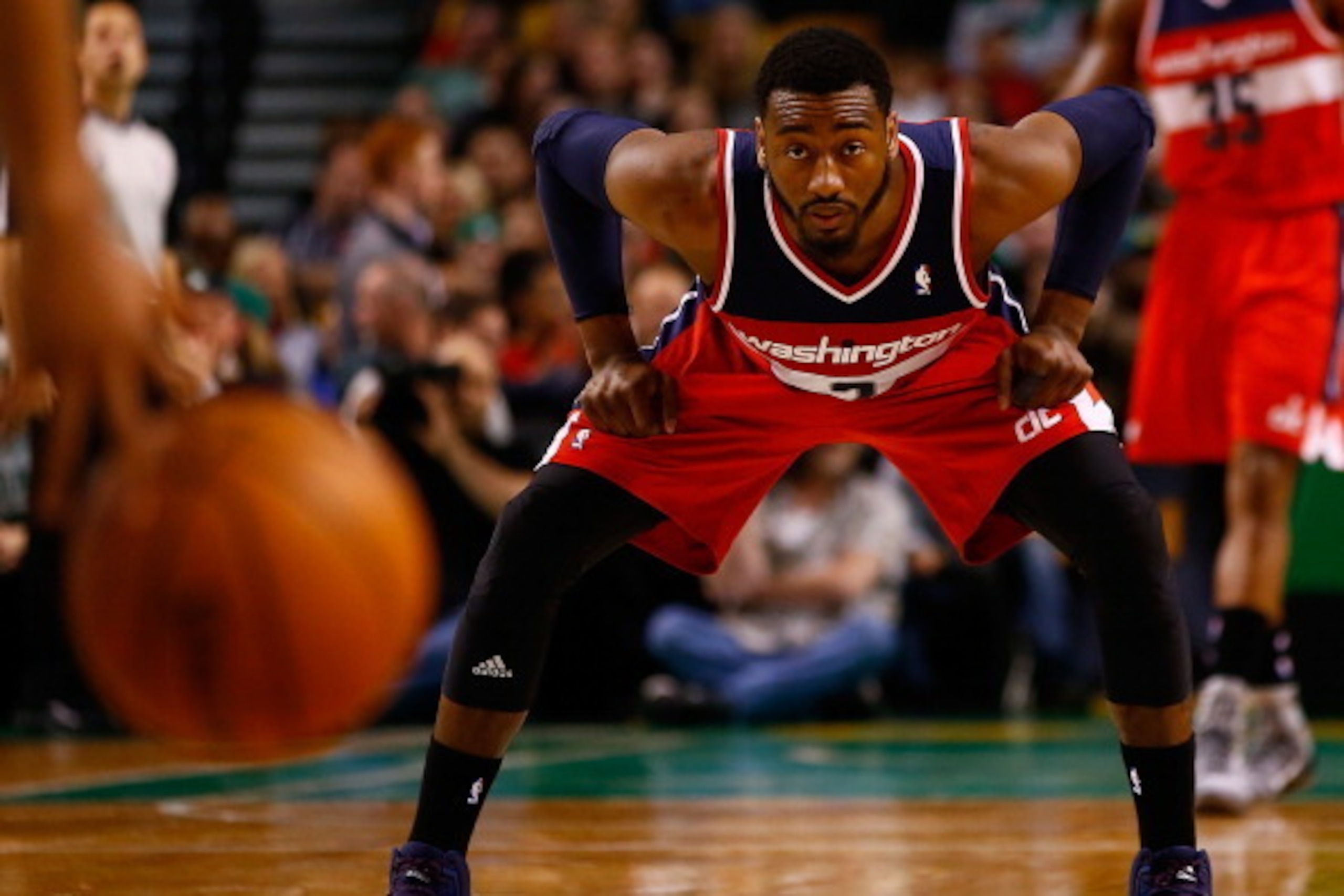 BOSTON, MA - APRIL 16:  John Wall #2 of the Washington Wizards waits to defend against the Boston Celtics in the second half during the game at TD Garden on April 16, 2014 in Boston, Massachusetts. NOTE TO USER: User expressly acknowledges and agrees that