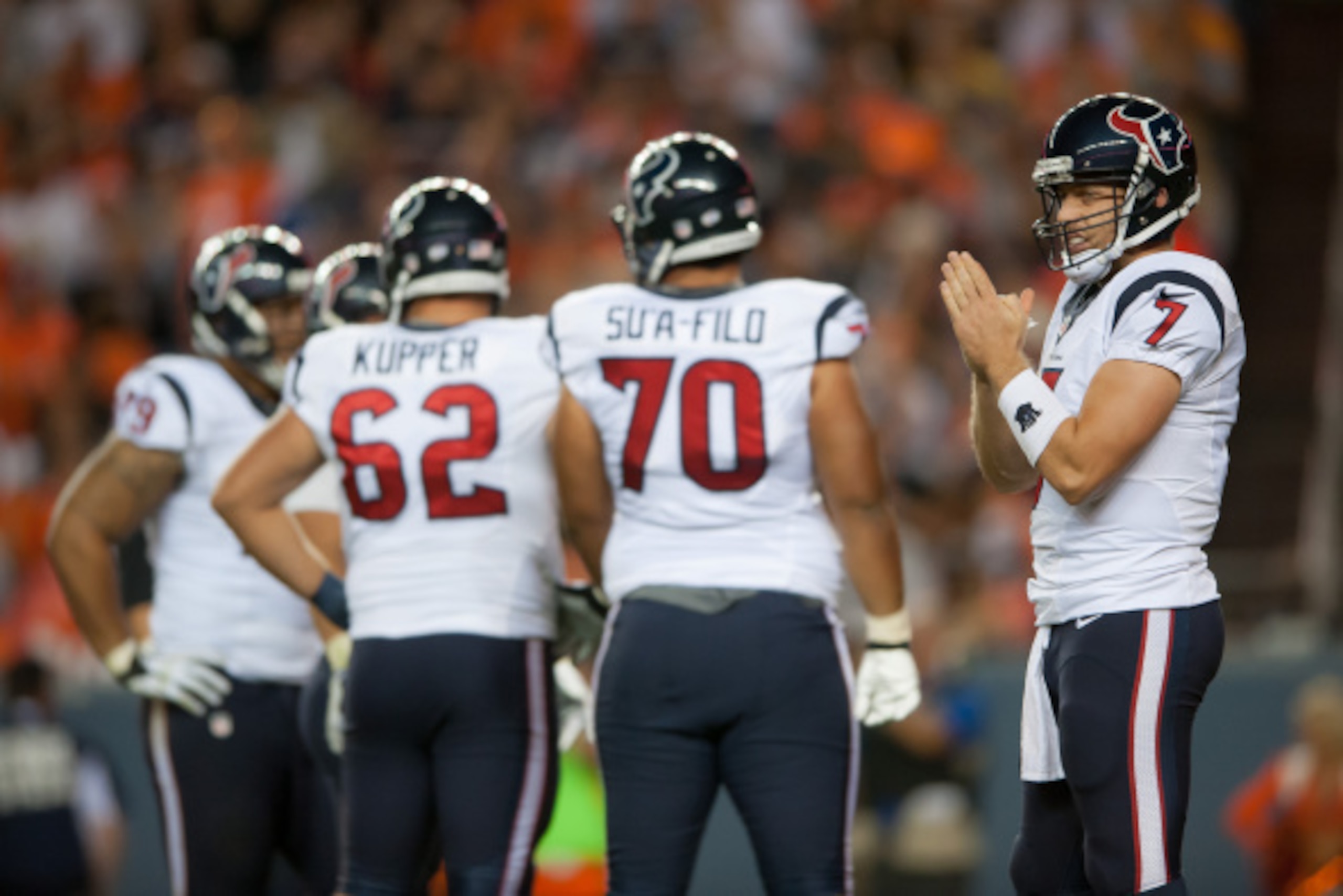DENVER, CO - AUGUST 23:  Quarterback Case Keenum #7 of the Houston Texans looks toward the Texans sideline between plays during a preseason game against the Denver Broncos at Sports Authority Field at Mile High on August 23, 2014 in Denver, Colorado.  (Ph