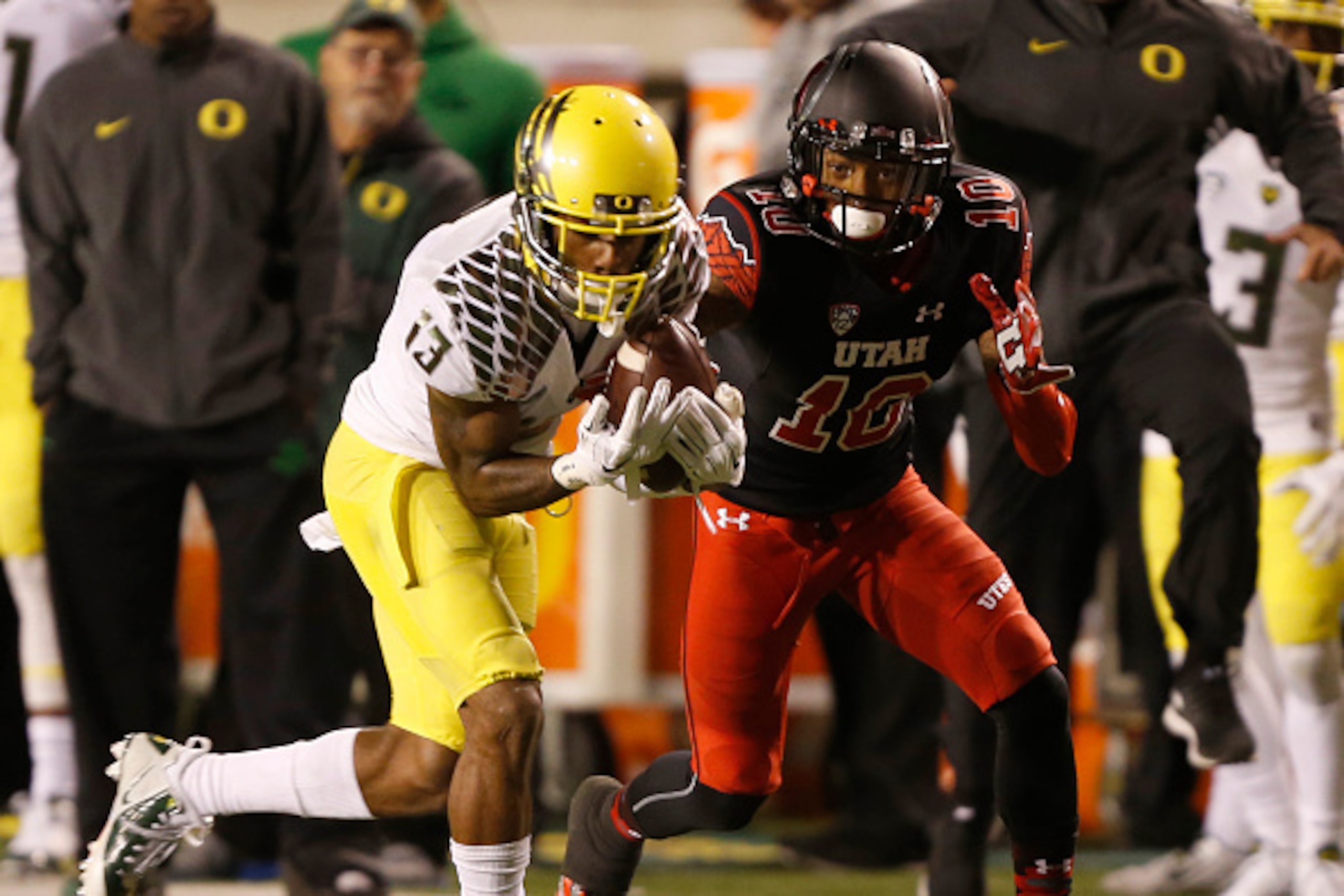 SALT LAKE CITY, UT - NOVEMBER 8:  defensive back Troy Hill #13 of the Oregon Ducks intercepts the ball from wide receiver Delshawn McClellon #10 of the Utah Utes during the second half of an NCAA football game November 8, 2014 at Rice-Eccles Stadium in Sa