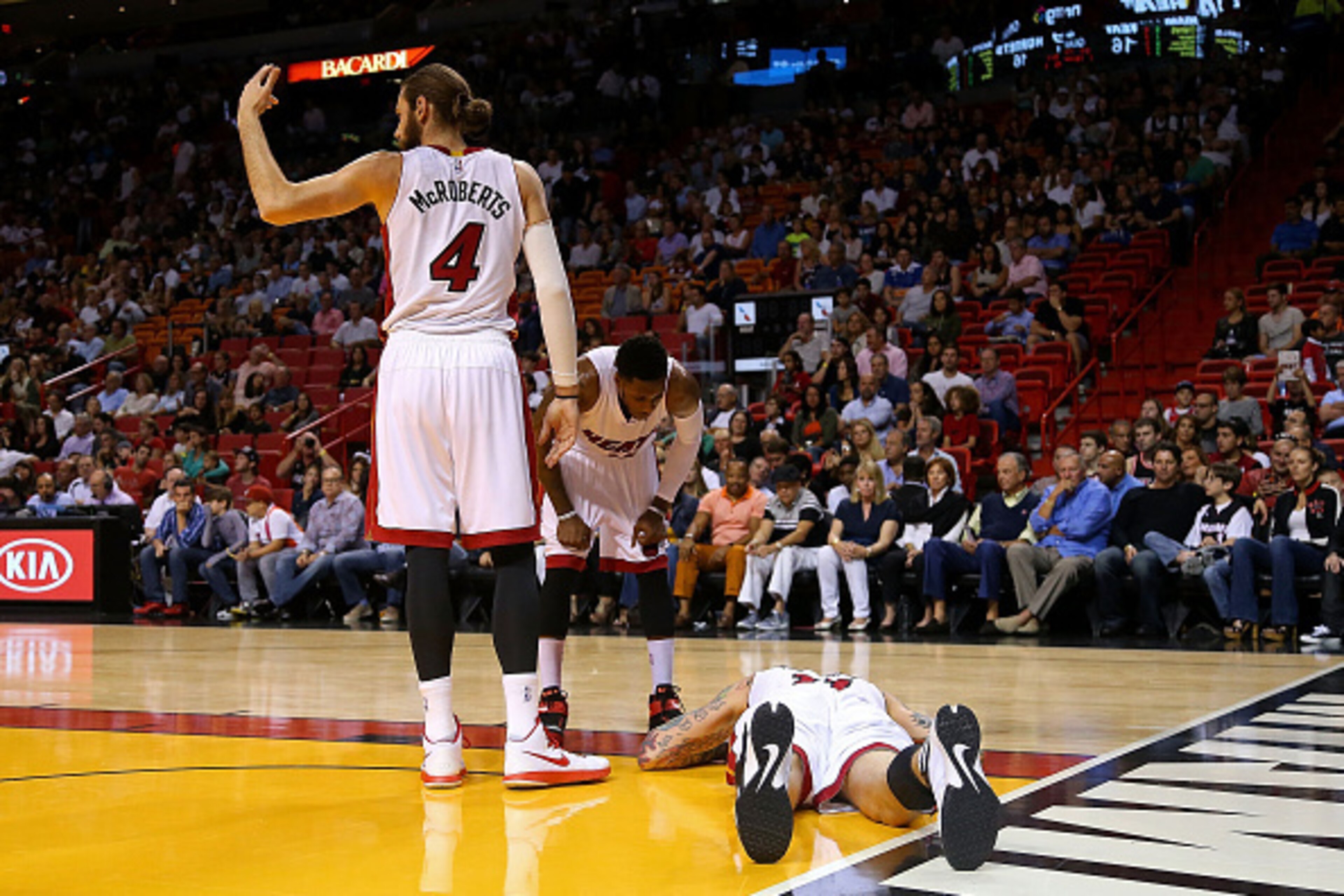 MIAMI, FL - NOVEMBER 23: Josh McRoberts #4 of the Miami Heat motions to the trainer after Chris Andersen #11 injures his ankle during a game against the Charlotte Hornets at American Airlines Arena on November 23, 2014 in Miami, Florida. NOTE TO USER: Use MIAMI, FL - NOVEMBER 23: Josh McRoberts #4 of the Miami Heat motions to the trainer after Chris Andersen #11 injures his ankle during a game against the Charlotte Hornets at American Airlines Arena on November 23, 2014 in Miami, Florida. NOTE TO USER: Use