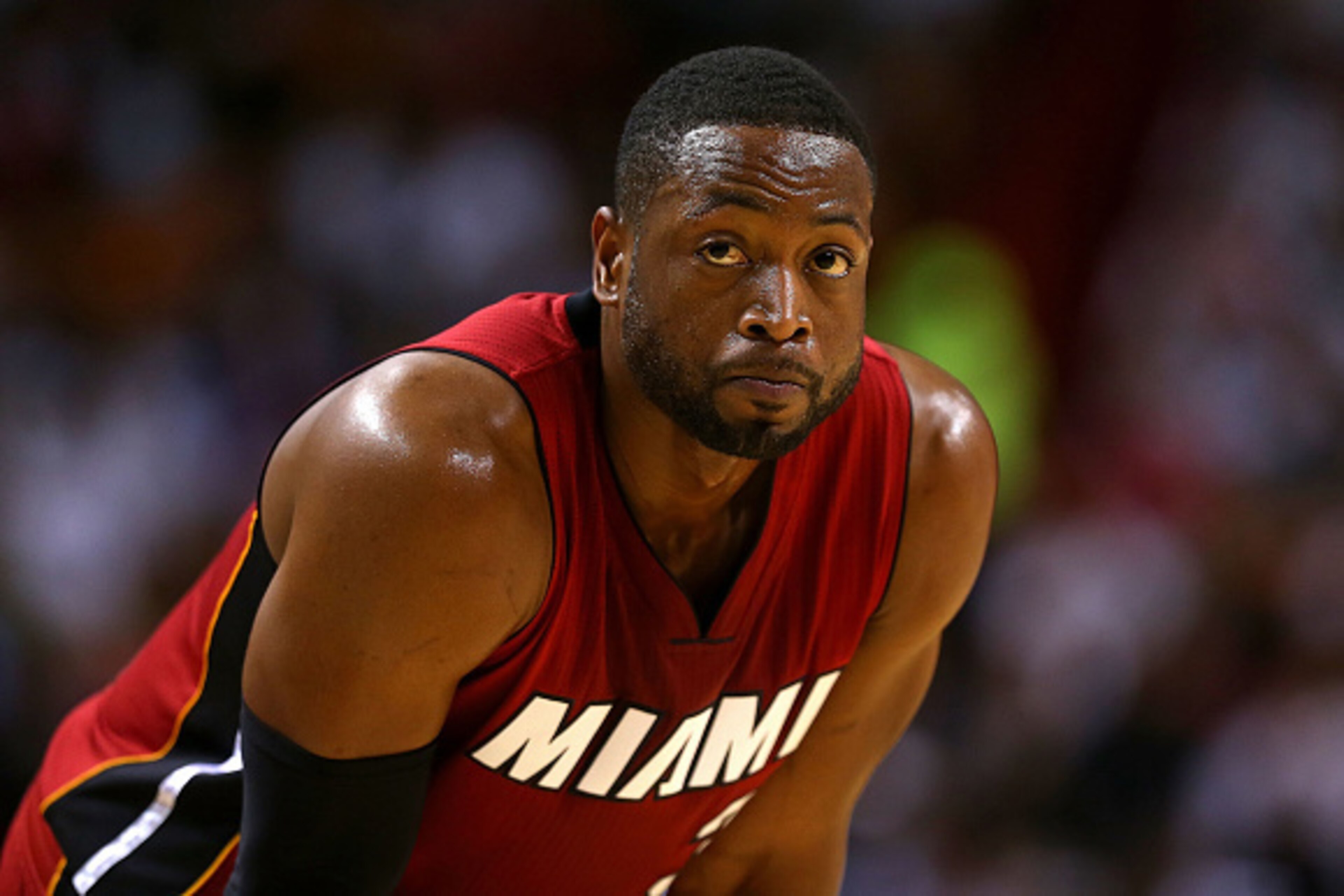 MIAMI, FL - DECEMBER 14: Dwyane Wade #3 of the Miami Heat looks on during a game against the Chicago Bulls at American Airlines Arena on December 14, 2014 in Miami, Florida. NOTE TO USER: User expressly acknowledges and agrees that, by downloading and/or MIAMI, FL - DECEMBER 14: Dwyane Wade #3 of the Miami Heat looks on during a game against the Chicago Bulls at American Airlines Arena on December 14, 2014 in Miami, Florida. NOTE TO USER: User expressly acknowledges and agrees that, by downloading and/or