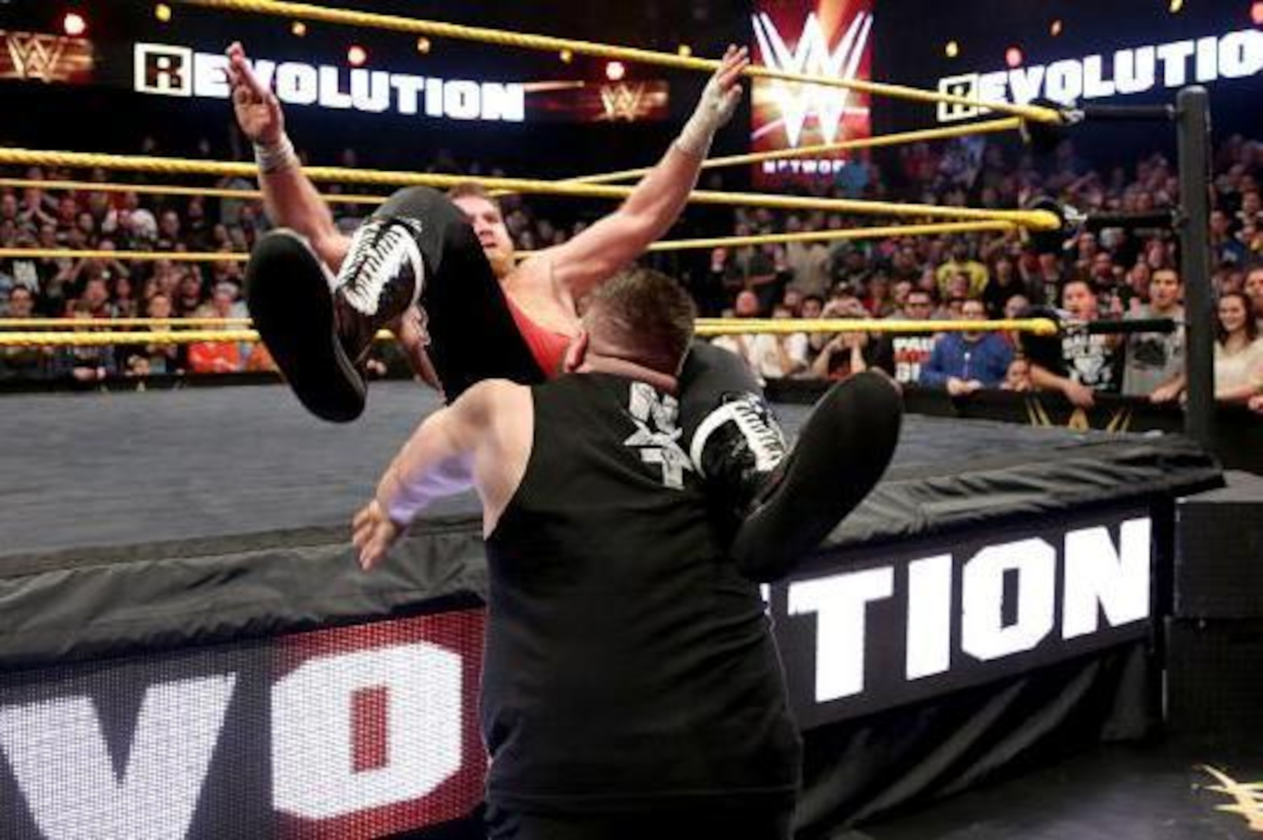 Kevin Owens powerbombs Sami Zayn.