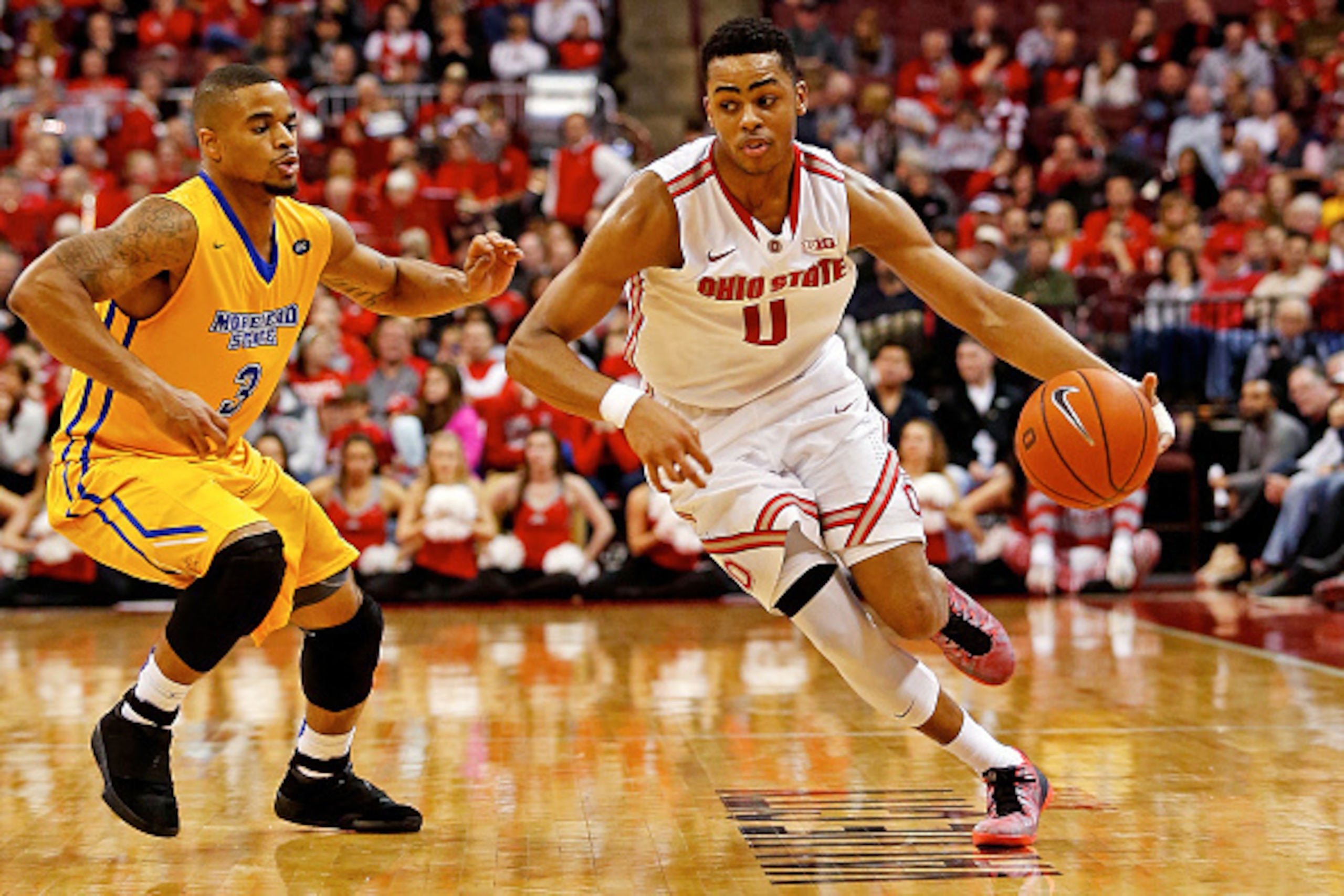 COLUMBUS, OH - DECEMBER 13:  D'Angelo Russell #0 of the Ohio State Buckeyes drives the ball past Corban Collins #3 of the Morehead State Eagles during the second half at Value City Arena on December 13, 2014 in Columbus, Ohio. Ohio State defeated Morhead 